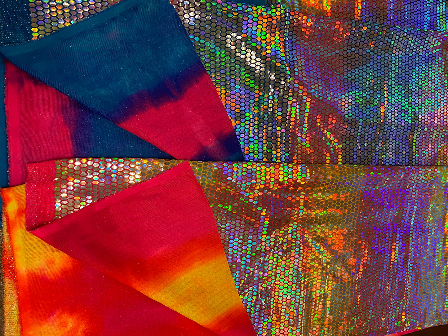 Hexagon tie dye Hologram sequins trans on Nylon metallic 2-way stretch 58/60” Sold by the YD. Ships worldwide from Los Angeles