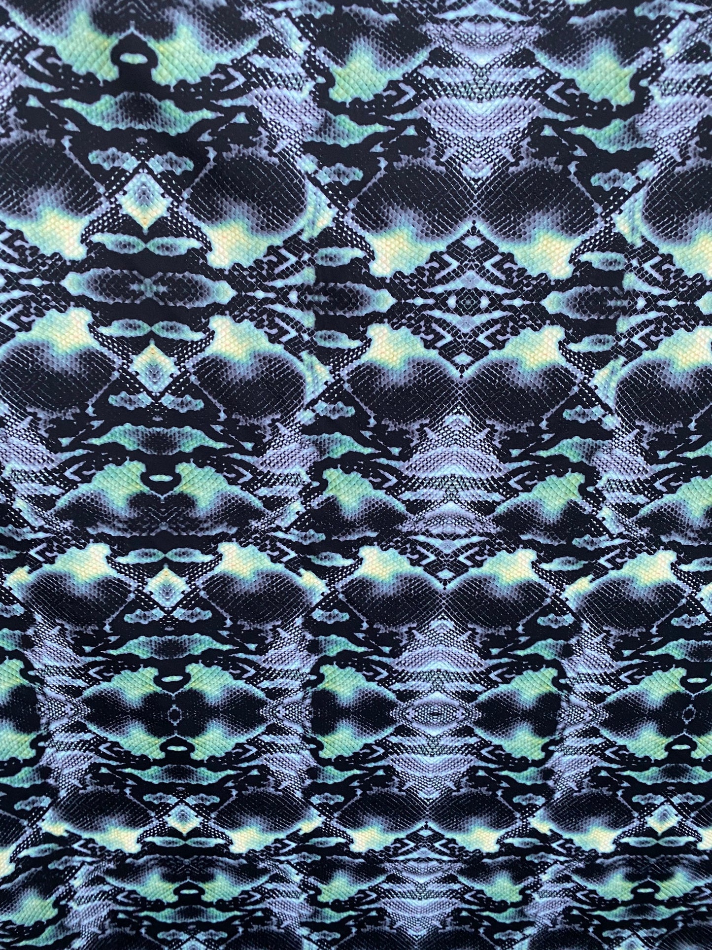 Serpent design Black/Green print on nylon spandex 4-way stretch 58/60” Sold by the YD. Ships worldwide from Los Angeles California USA.