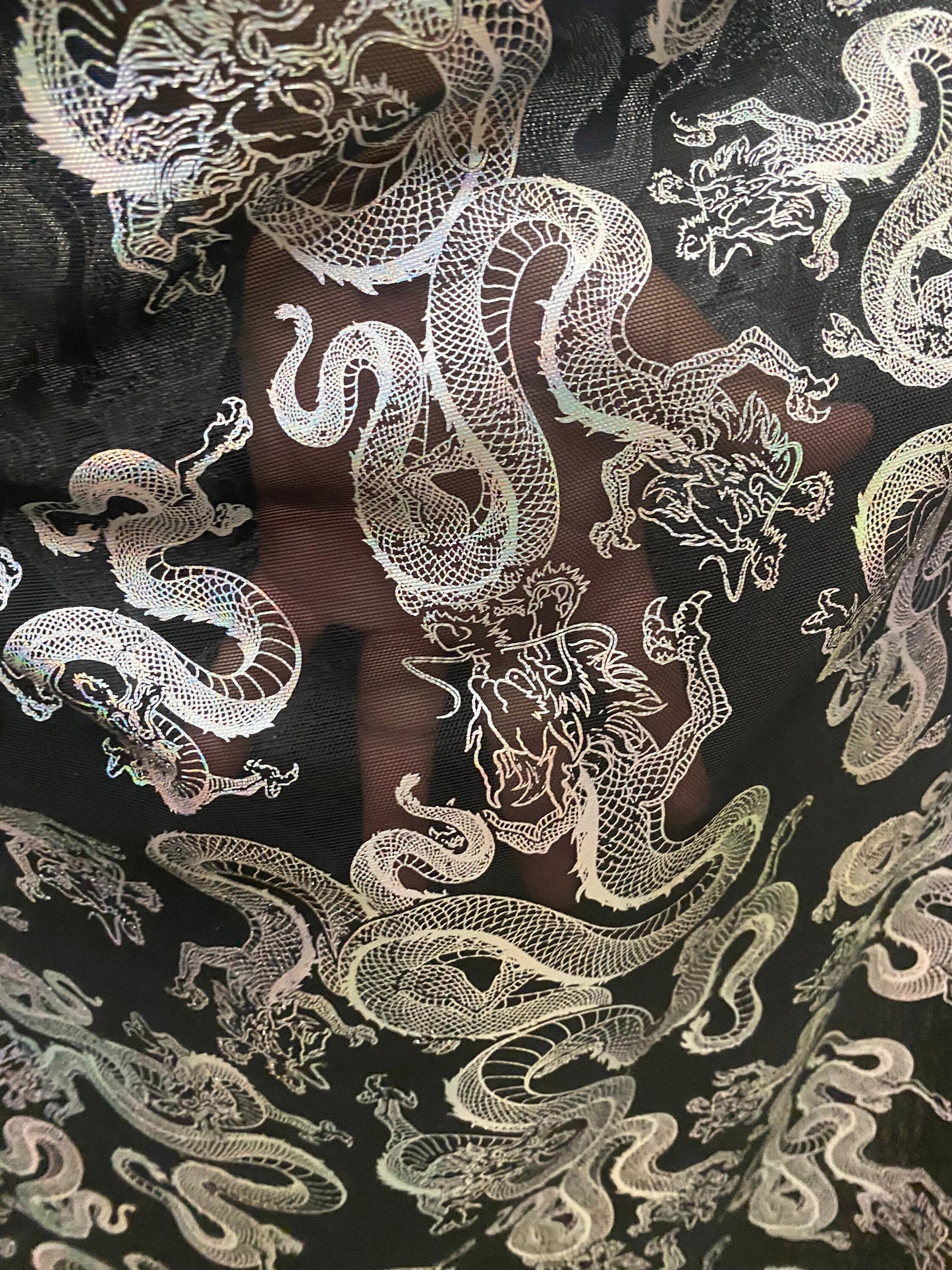 New Exotic Dragon design print on metallic power mesh nylon spandex 4-way stretch 58/60” Sold by the YD. Ships worldwide