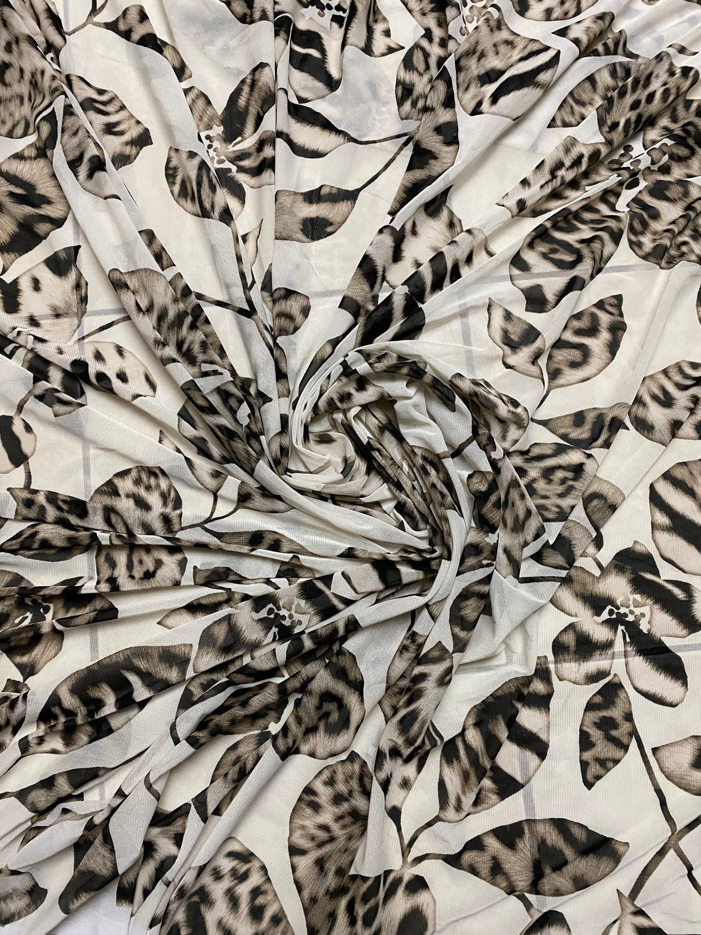 New Exotic flower animal print design on poly mesh 4-way stretch 58/60” Sold by the YD. Ships Worldwide from Los Angeles California USA.