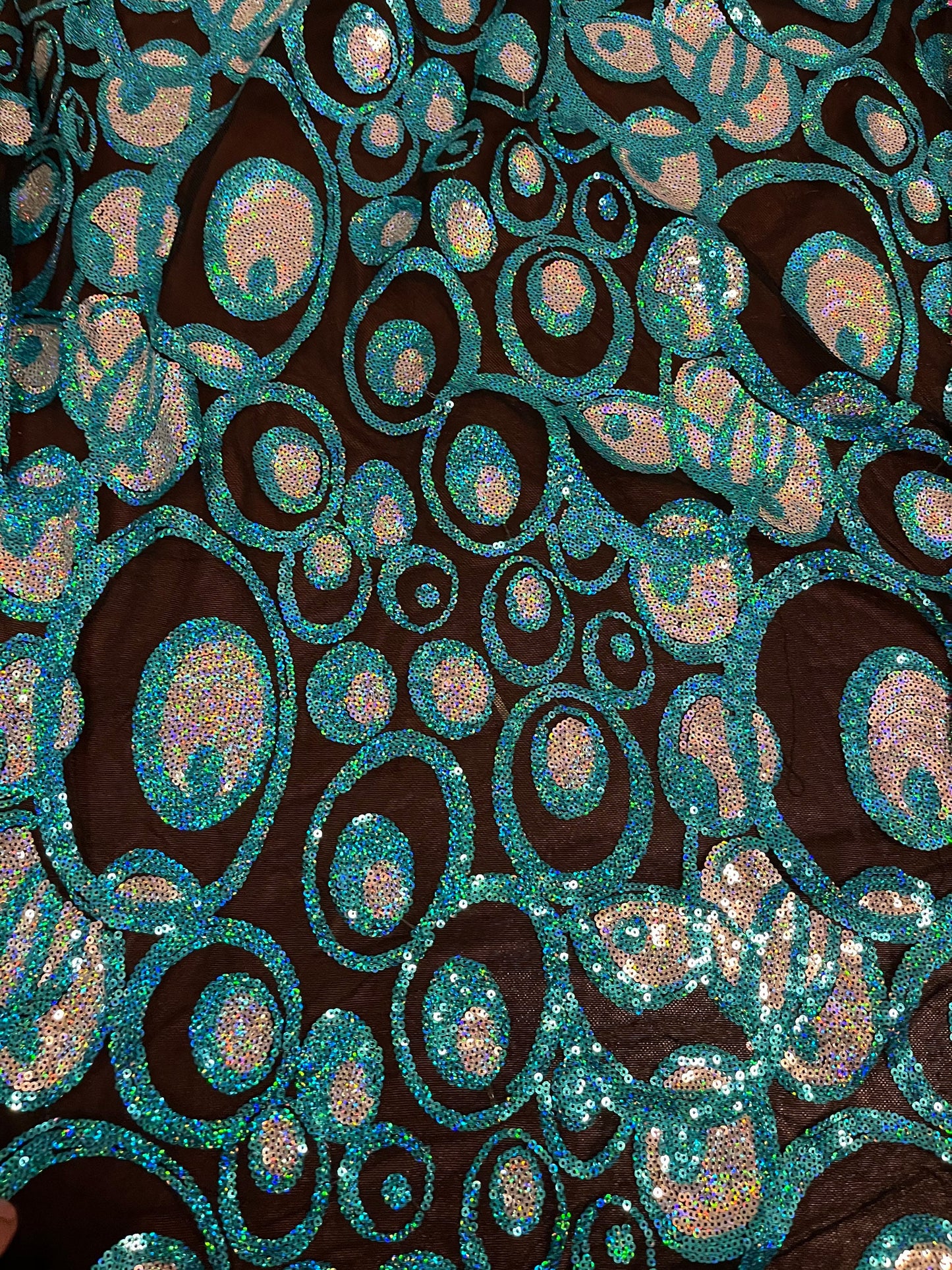 New peacock design hologram sequins embroidered on stretch mesh 2-way stretch 58/60” Sold by the YD. Ships Worldwide from Los Angeles CA USA