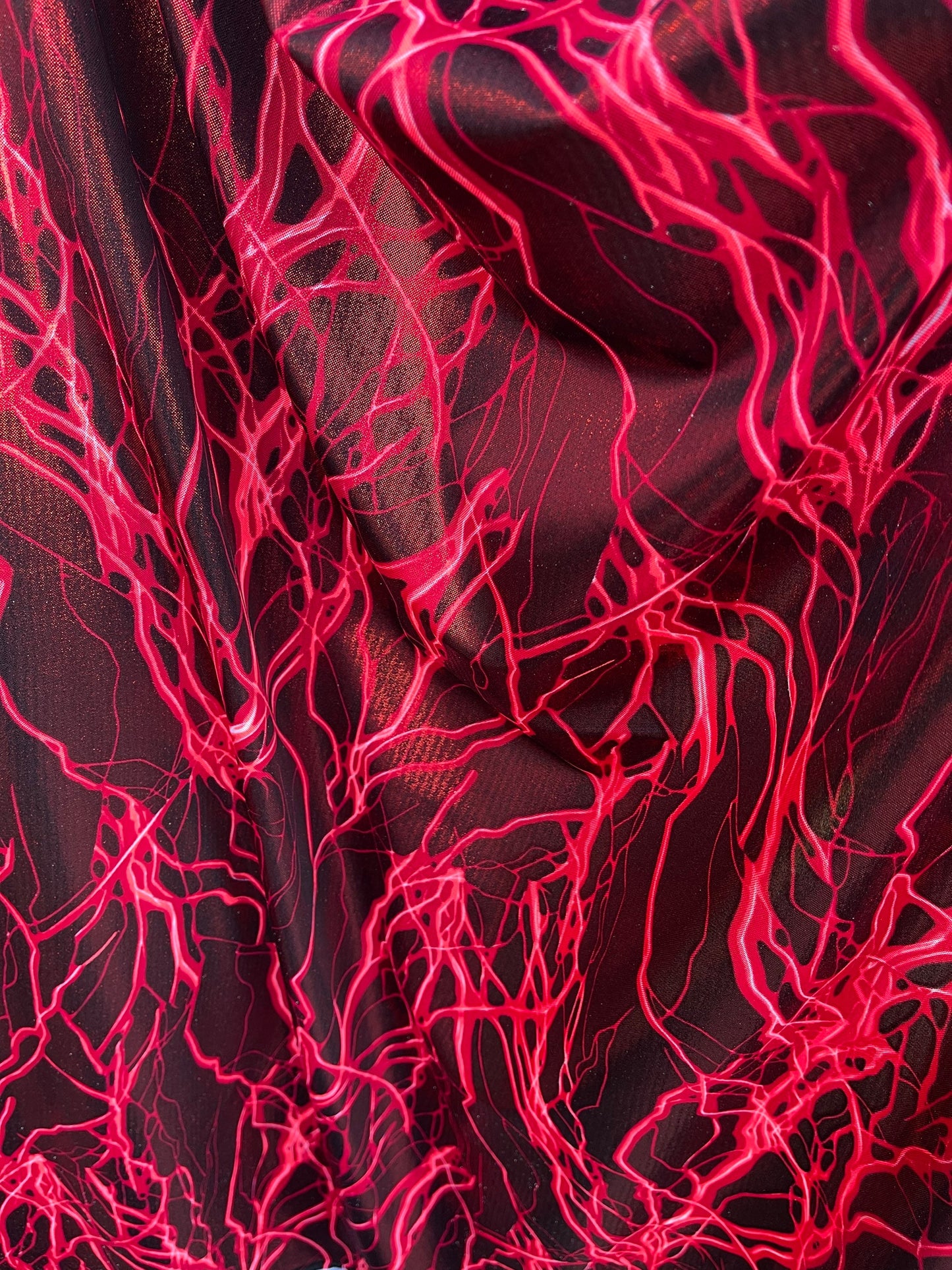 Thunderbolt design print on metallic nylon spandex 4way Stretch 58/60” Sold by the YD. Ships worldwide from Los Angeles California USA.