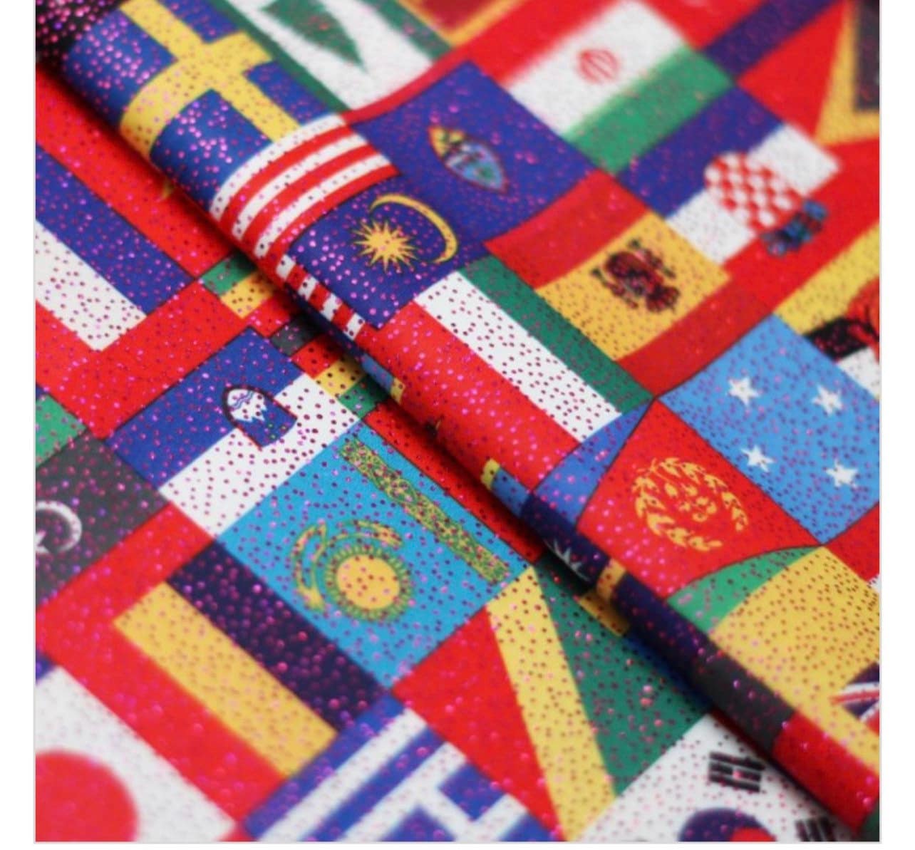 Internacional flags design print on best quality of nylon spandex with foggy foil all over 4-way stretch 58/60” Sold by the YD.