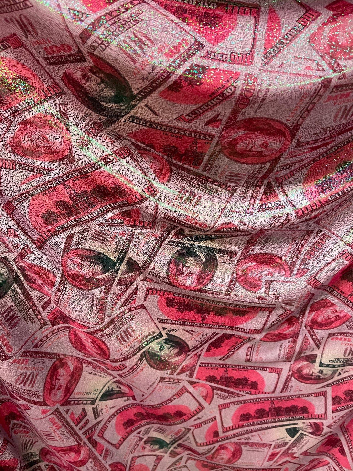 Money design 100 dollars bill print on metallic nylon spandex 4-way stretch 58/60” Sold by the YD. Ships Worldwide from Los Angeles cali.