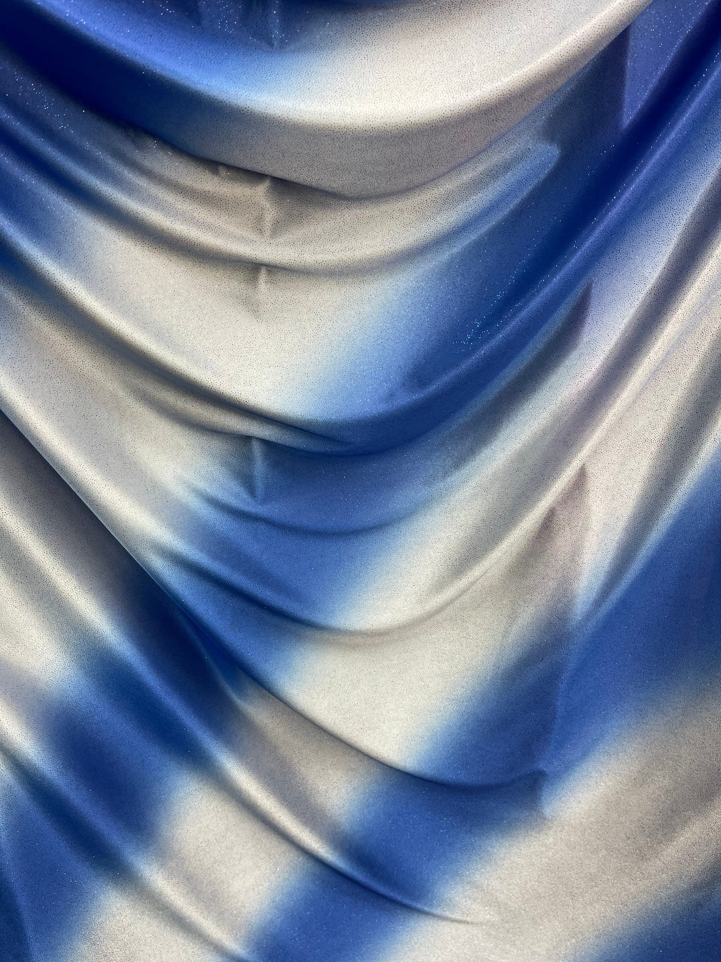 Tie dye diagonal design Sapphire/silver poliéster fabric with glitter 2-way stretch 58/60” Sold by the YD. Ships worldwide