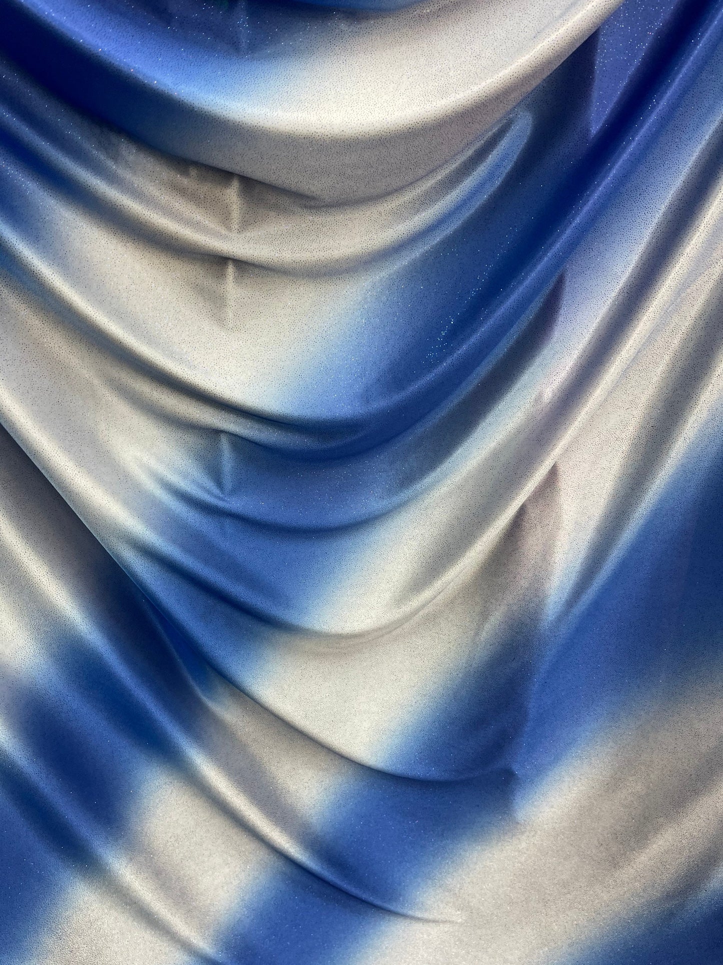 Tie dye diagonal design Sapphire/silver poliéster fabric with glitter 2-way stretch 58/60” Sold by the YD. Ships worldwide