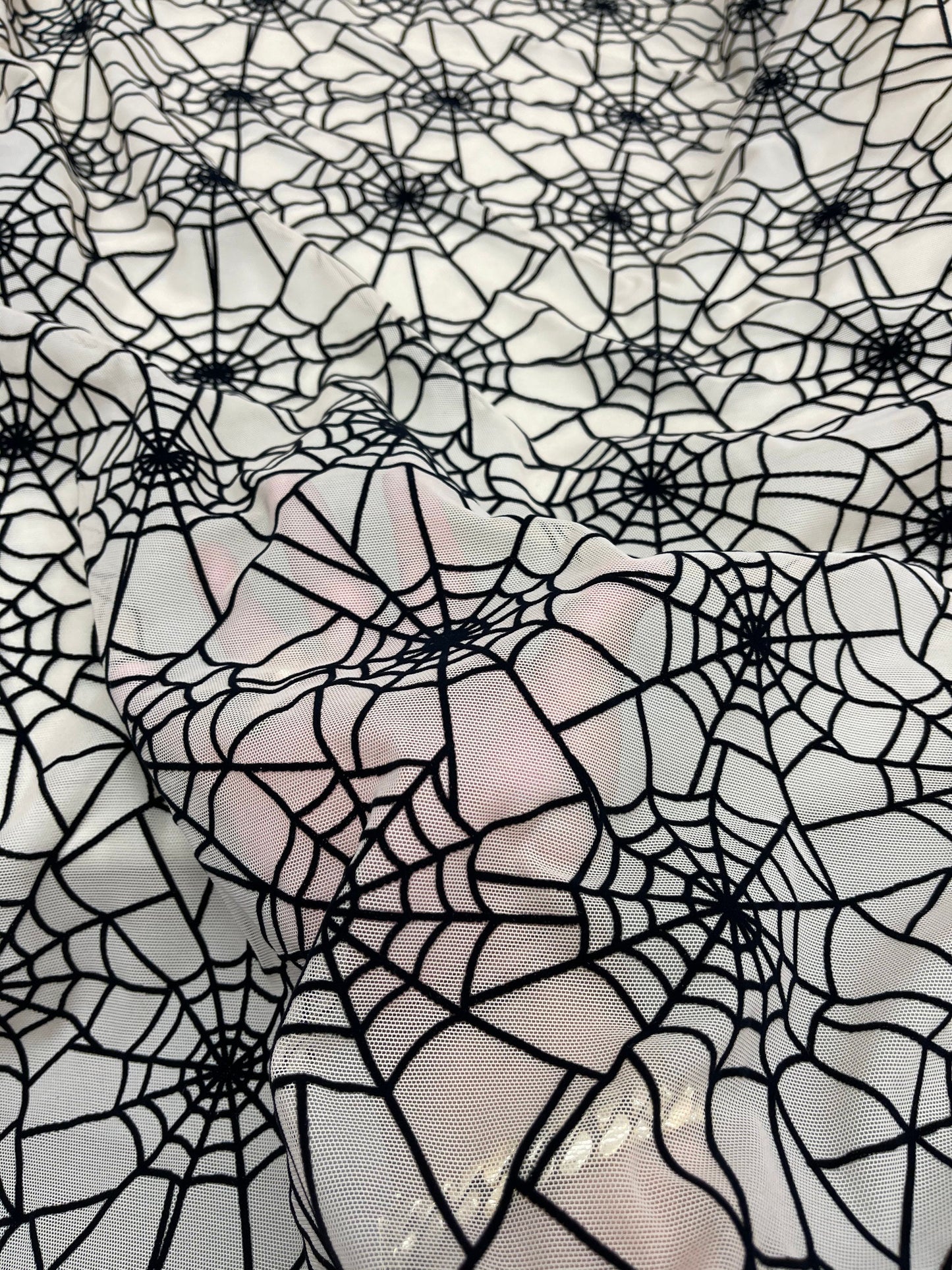 New Spider-Man design nude/back print on power mesh with flocking great quality nylon mesh 4-way stretch 58/60” Sold by the YD.