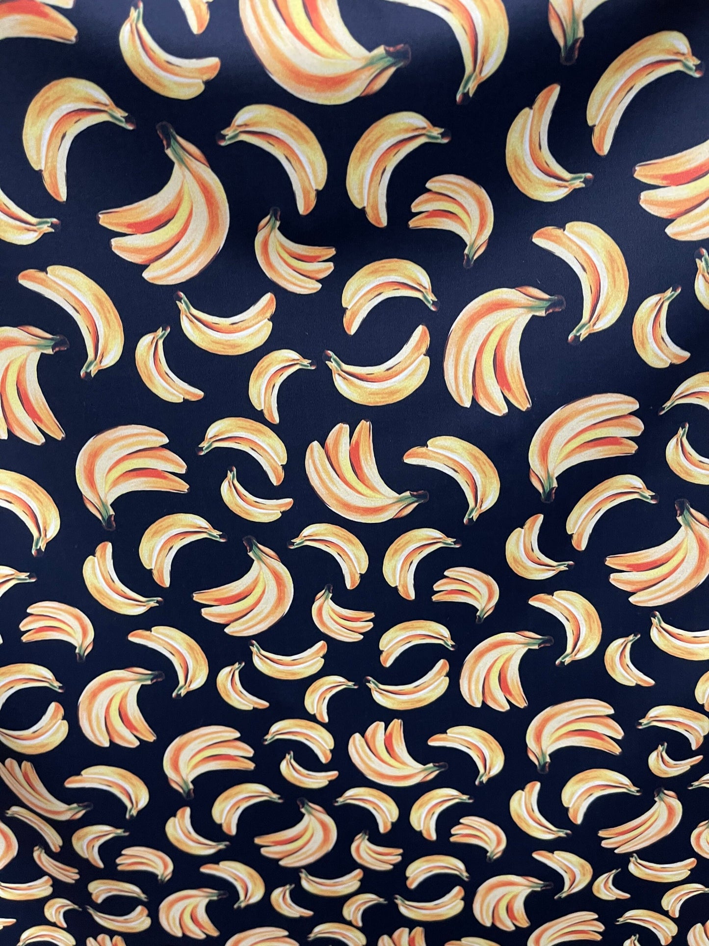 Bananas design black/yellow print on best nylon spandex 4way stretch 58/60” Sold by the YD. Ships worldwide from Los Angeles California USA.