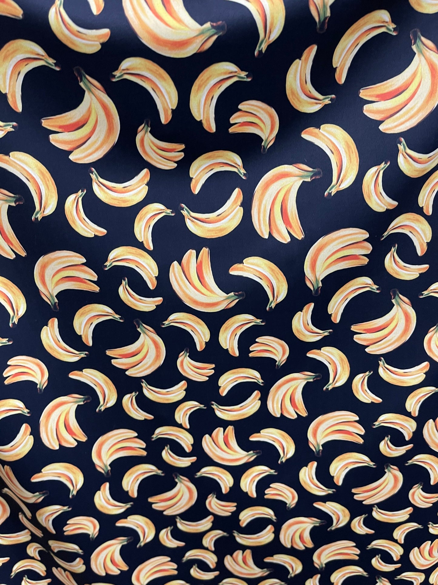 Bananas design black/yellow print on best nylon spandex 4way stretch 58/60” Sold by the YD. Ships worldwide from Los Angeles California USA.