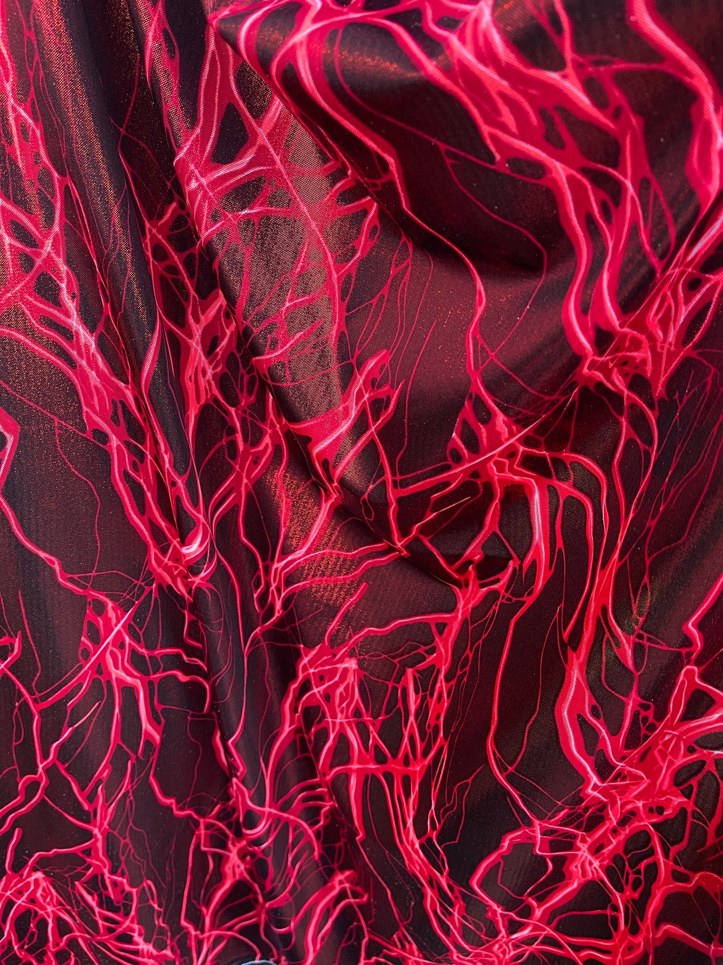 Thunderbolt design print on metallic nylon spandex 4way Stretch 58/60” Sold by the YD. Ships worldwide from Los Angeles California USA.