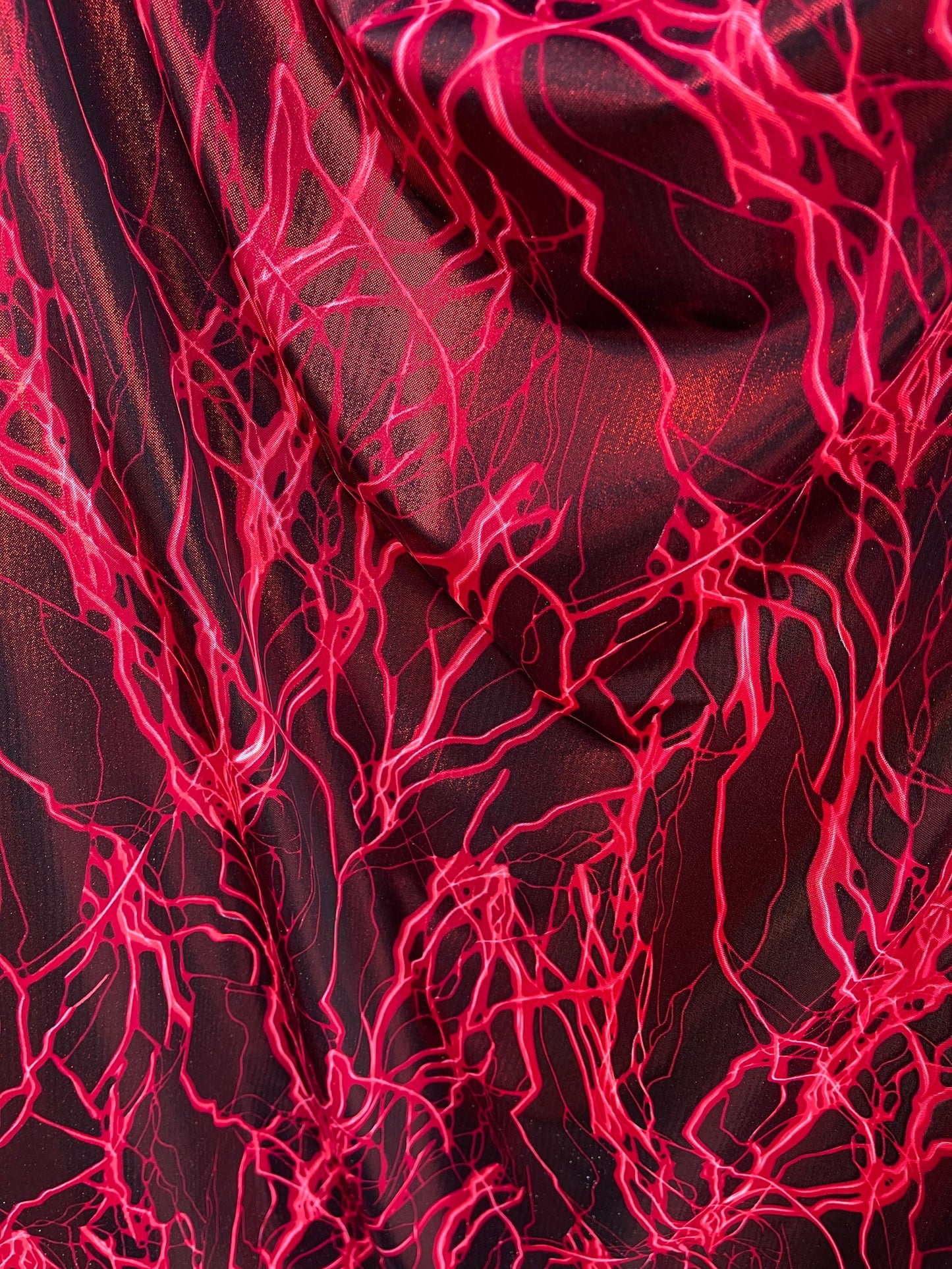 Thunderbolt design print on metallic nylon spandex 4way Stretch 58/60” Sold by the YD. Ships worldwide from Los Angeles California USA.