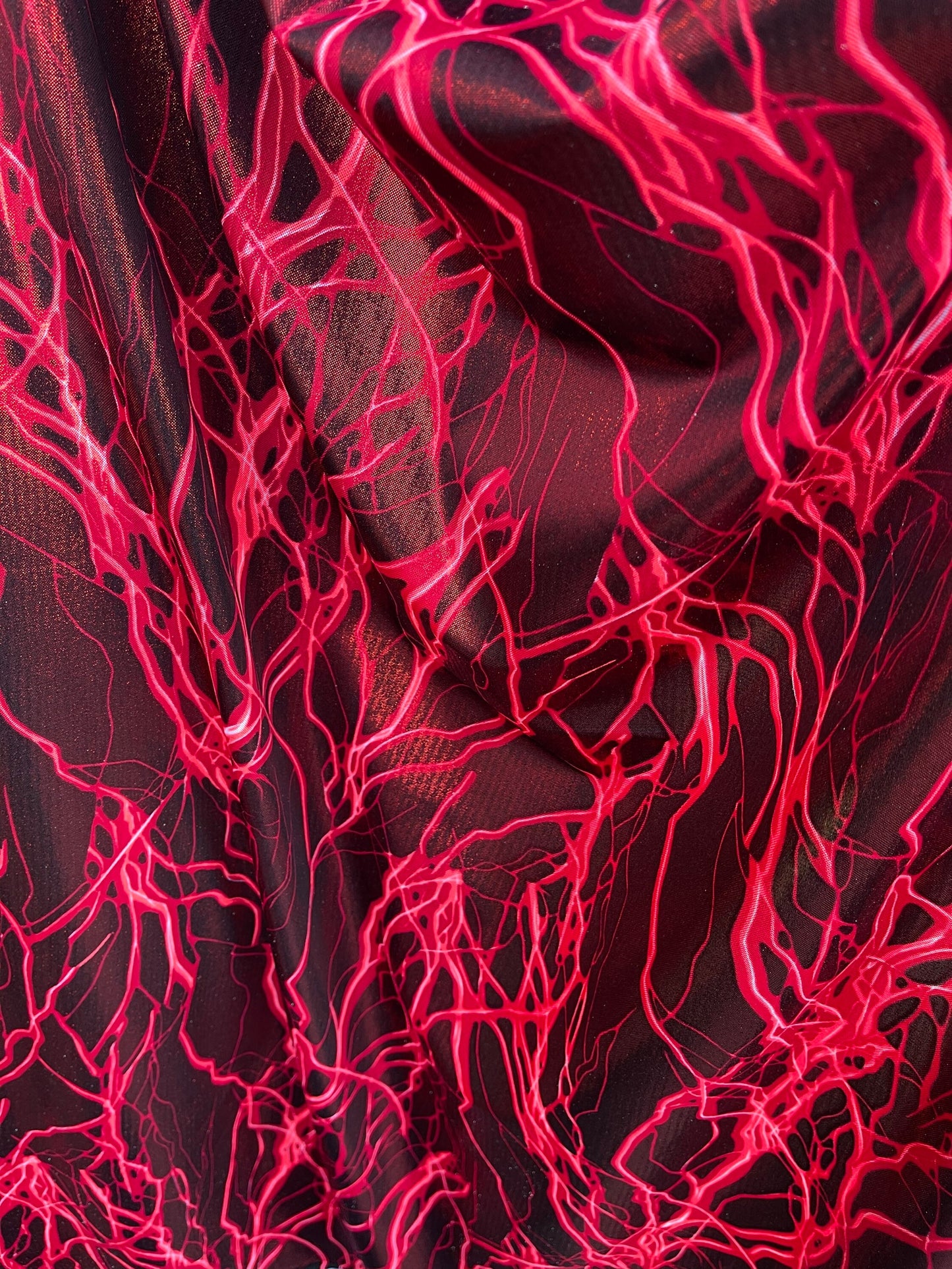 Thunderbolt design print on metallic nylon spandex 4way Stretch 58/60” Sold by the YD. Ships worldwide from Los Angeles California USA.