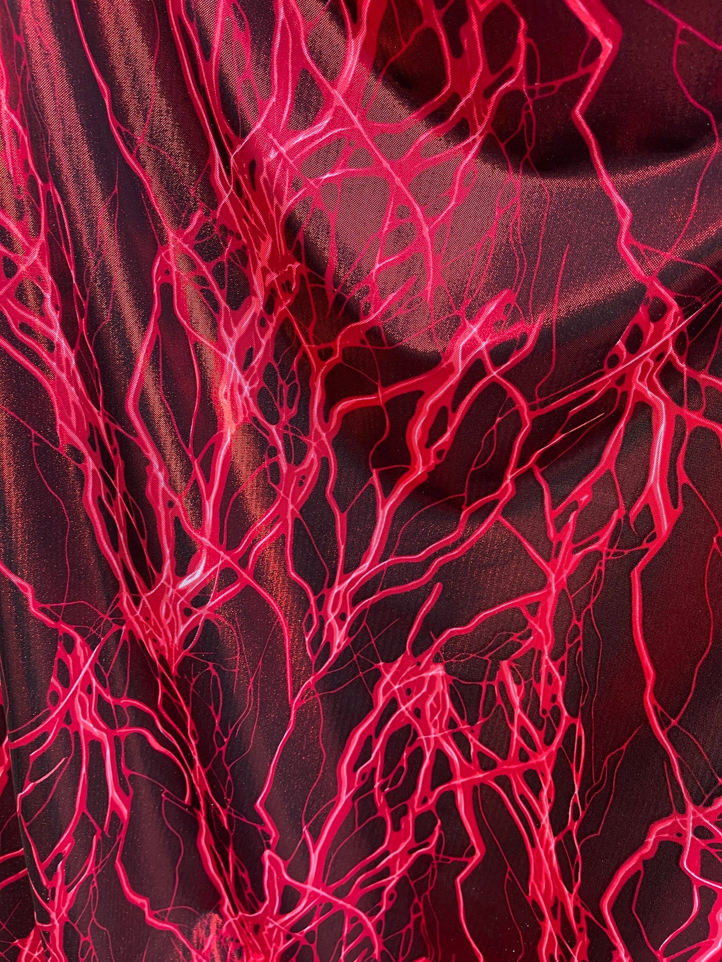 Thunderbolt design print on metallic nylon spandex 4way Stretch 58/60” Sold by the YD. Ships worldwide from Los Angeles California USA.