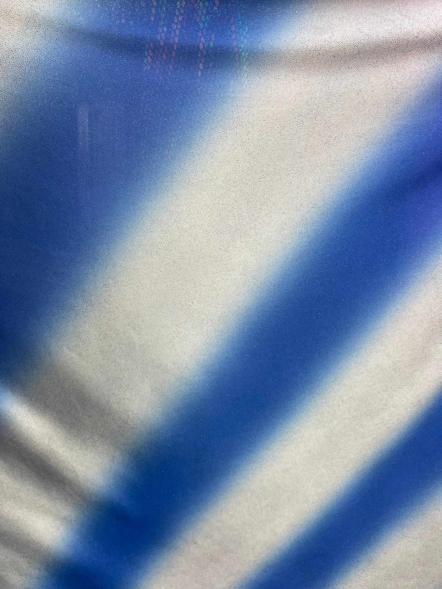 Tie dye diagonal design Sapphire/silver poliéster fabric with glitter 2-way stretch 58/60” Sold by the YD. Ships worldwide
