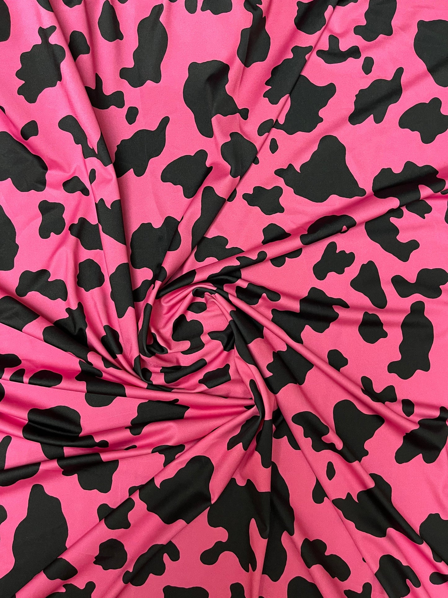 Moo Moo cow design Fuchsia/black print on best quality of nylon spandex 4-way stretch 58/60” Sold by the YD. Ships Worldwide from Los Angele