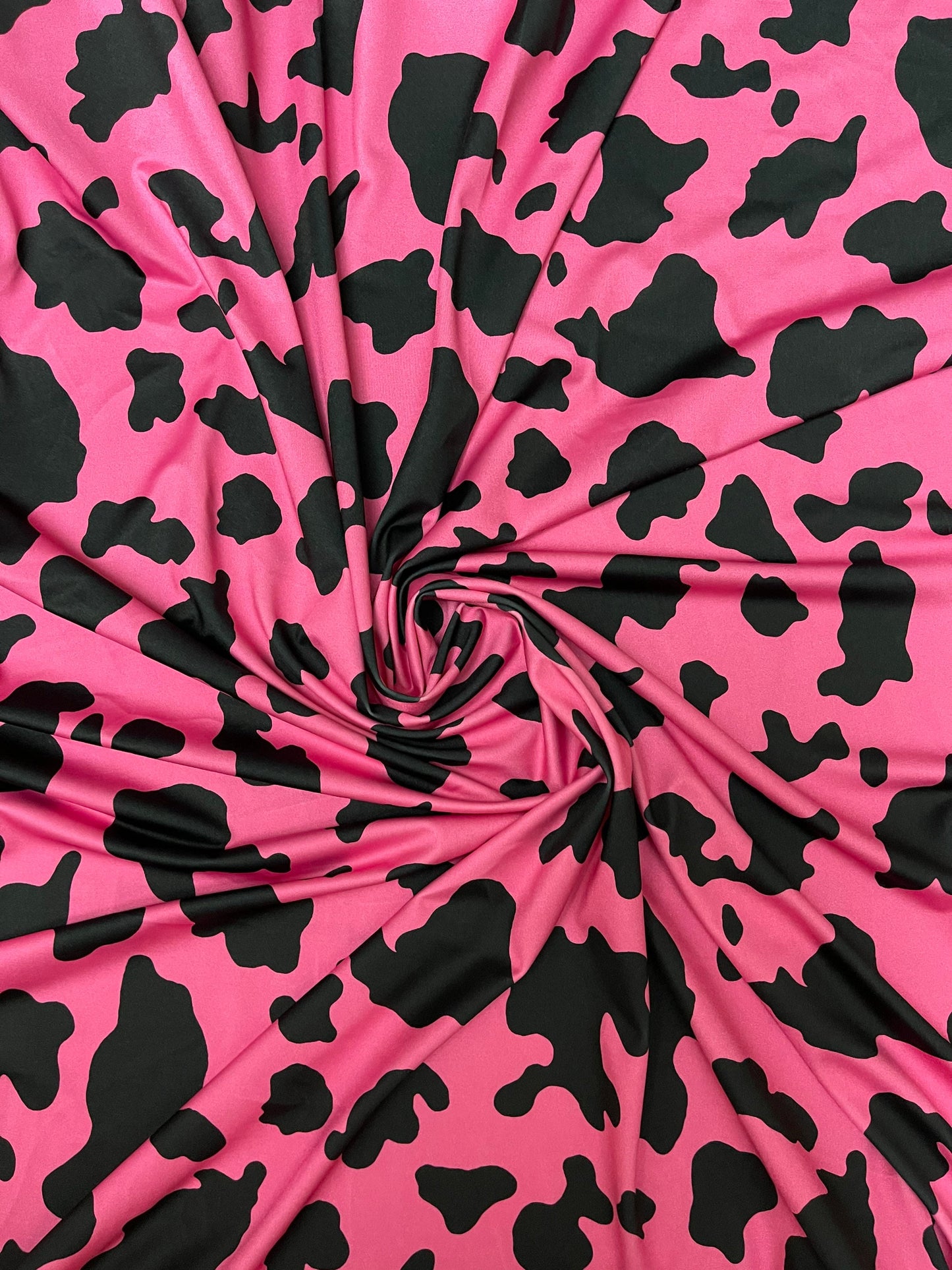 Moo Moo cow design Fuchsia/black print on best quality of nylon spandex 4-way stretch 58/60” Sold by the YD. Ships Worldwide from Los Angele