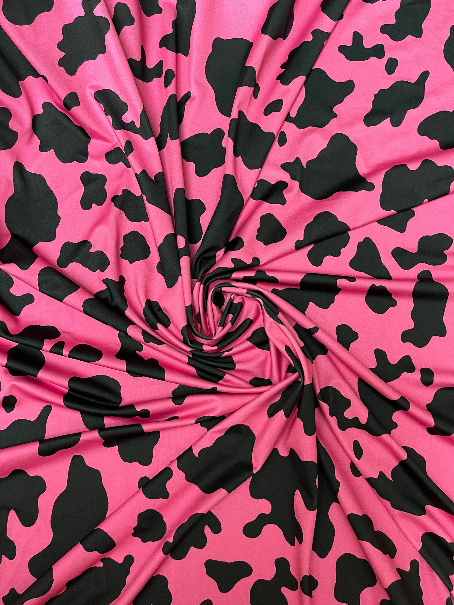 Moo Moo cow design Fuchsia/black print on best quality of nylon spandex 4-way stretch 58/60” Sold by the YD. Ships Worldwide from Los Angele