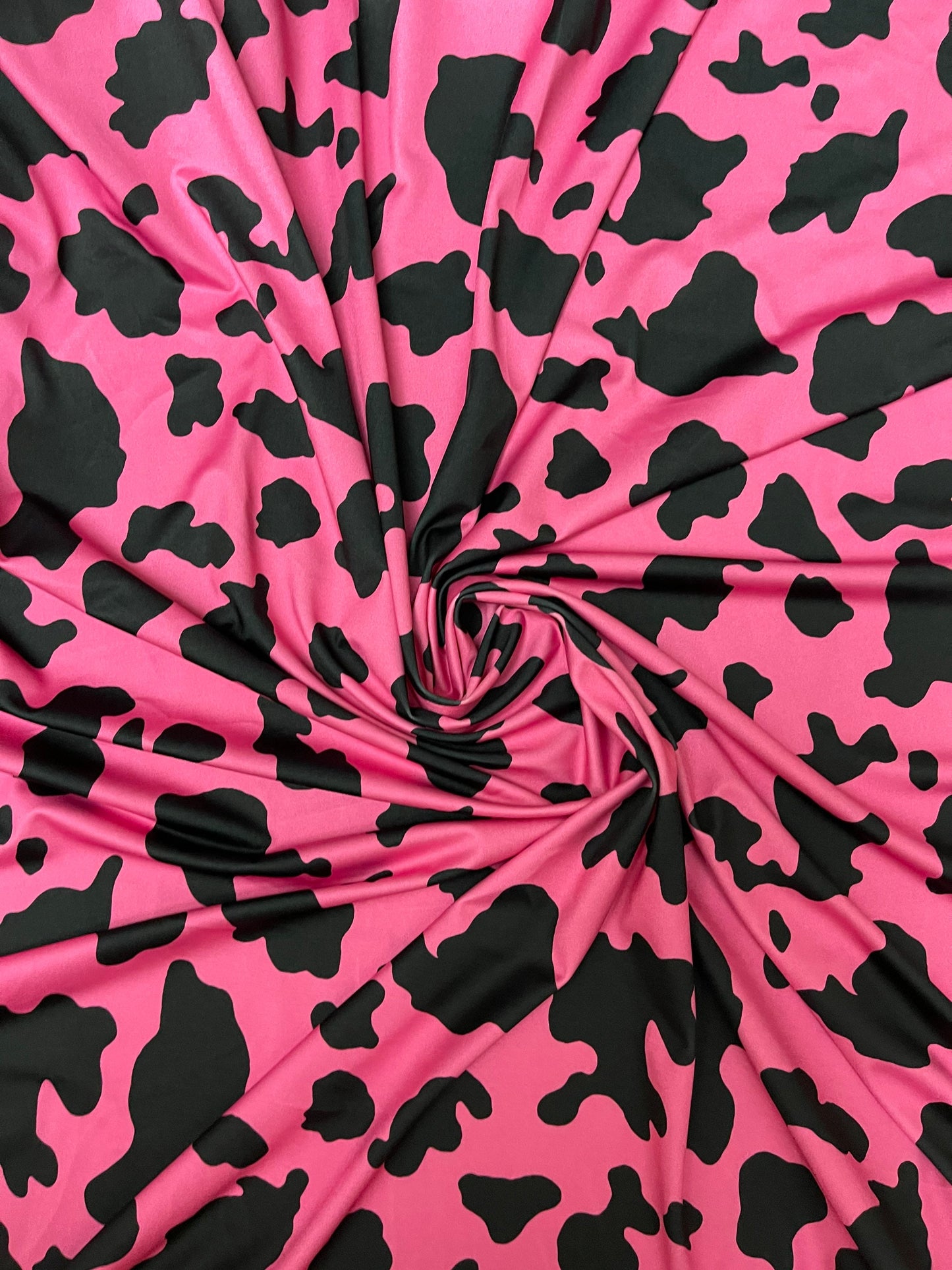 Moo Moo cow design Fuchsia/black print on best quality of nylon spandex 4-way stretch 58/60” Sold by the YD. Ships Worldwide from Los Angele