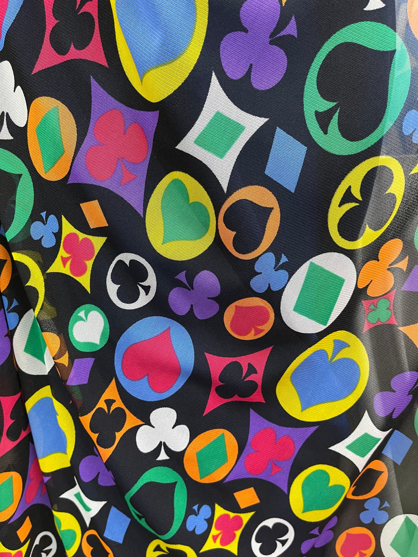 Symbol playing cards designs print on power mesh 4-way stretch 58/60” Sold by the YD. Ships Worldwide from Los Angeles California USA.
