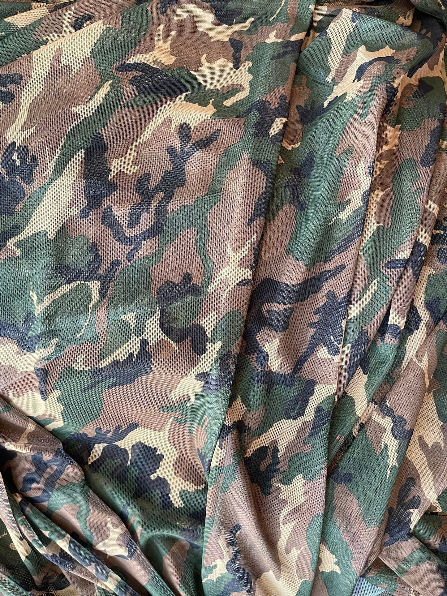 Camouflage design small size on power mesh 4way stretch 58/60” Sold by the YD. Ships worldwide from Los Angeles California USA