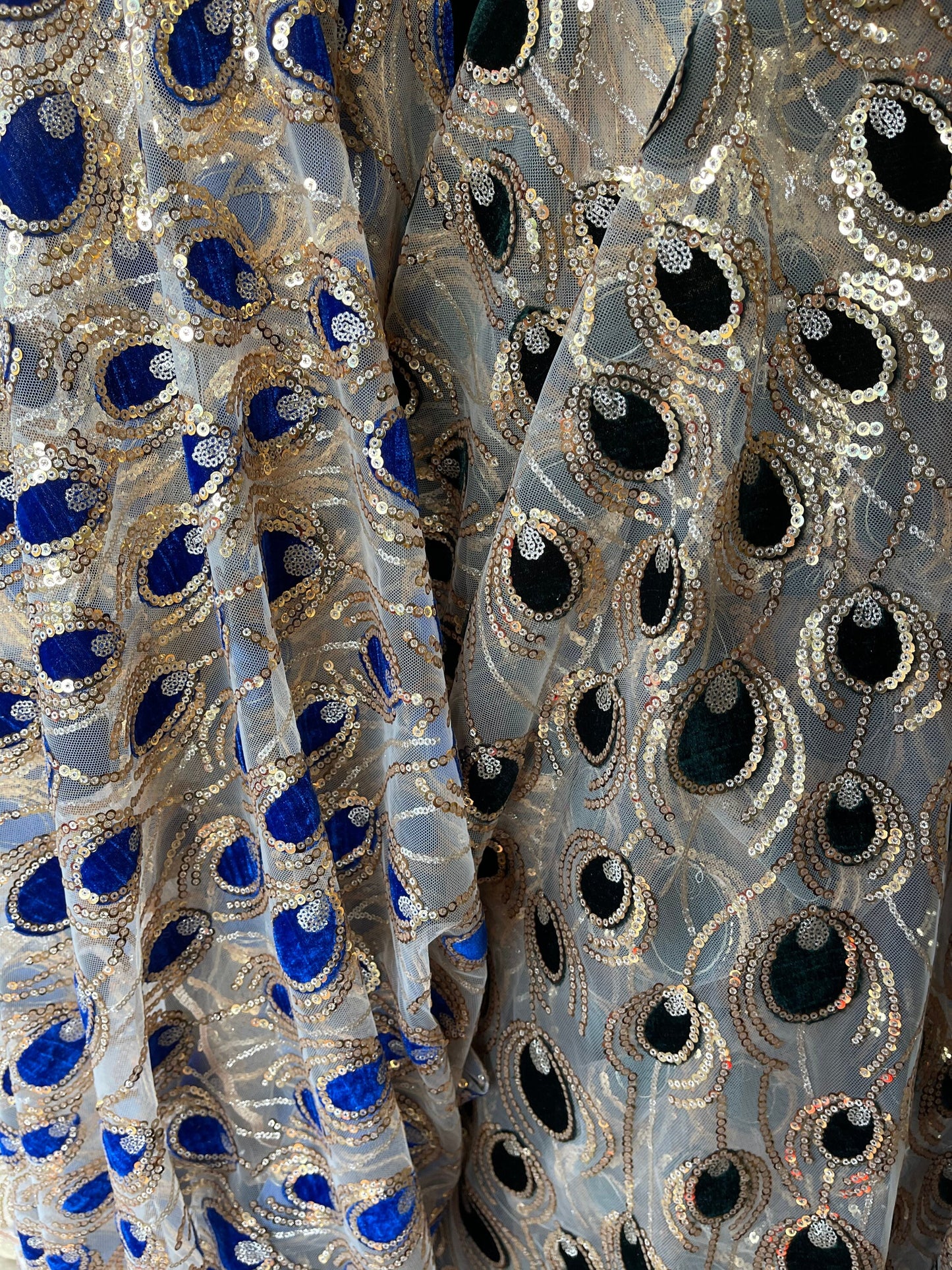 New Peacock design embroidered on stretch mesh 2-way 55/57 Sold by the YD. Ships Worldwide from Los Angeles California USA.
