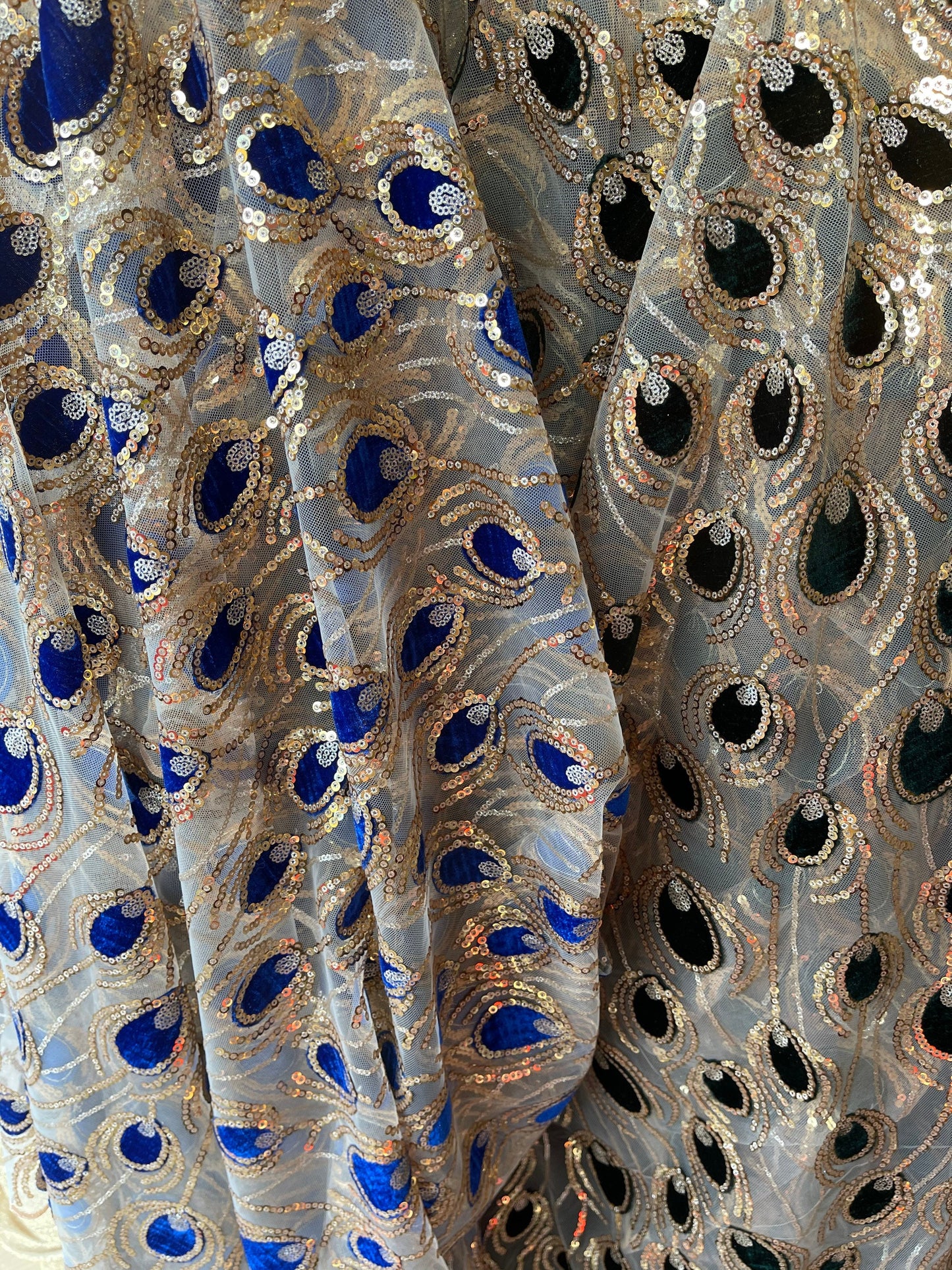 New Peacock design embroidered on stretch mesh 2-way 55/57 Sold by the YD. Ships Worldwide from Los Angeles California USA.