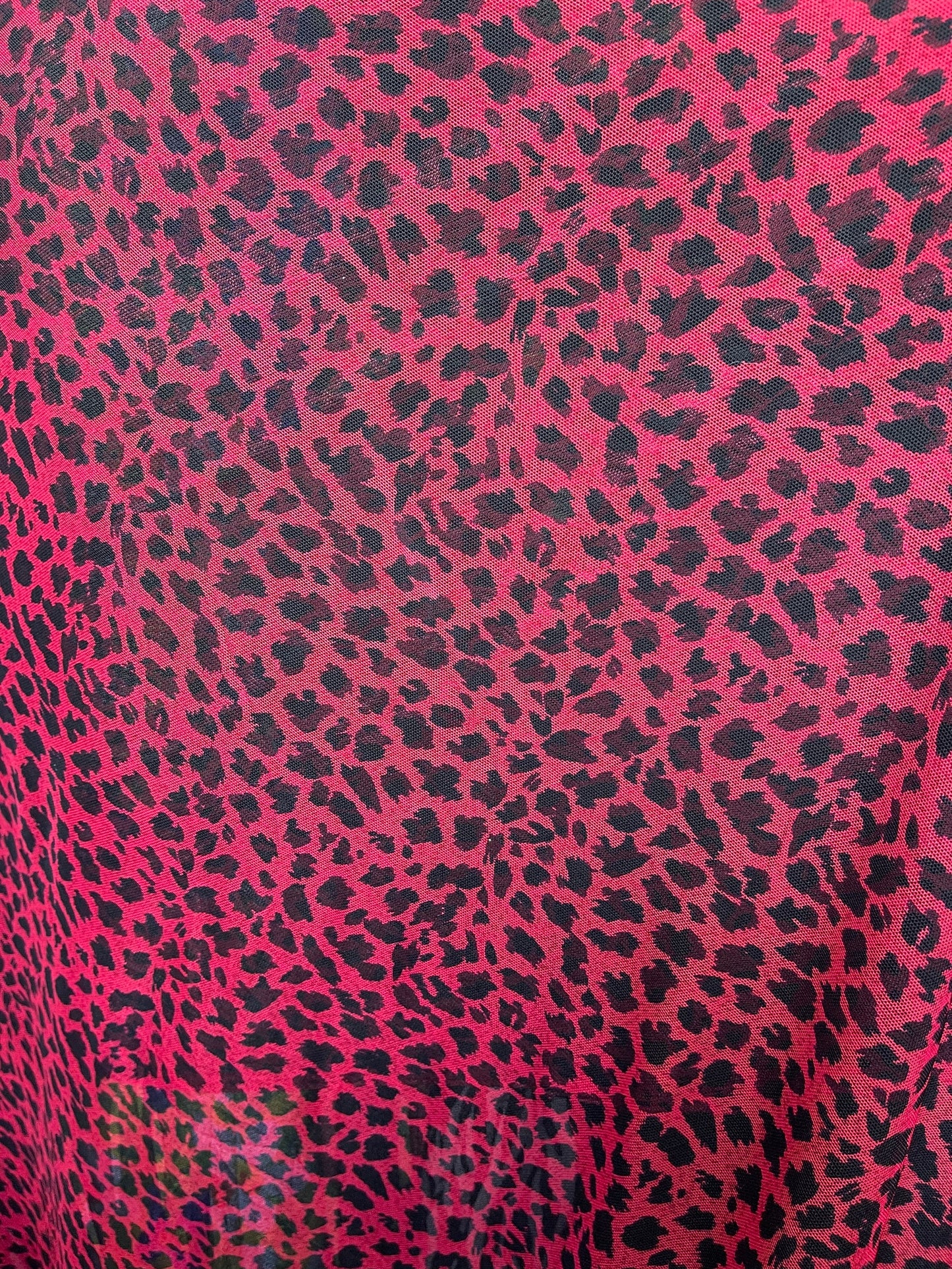 New power mesh animal printCheetah design red/black 4-way stretch 58/60” Sold by the YD. Ships worldwide from Los Angeles California USA.