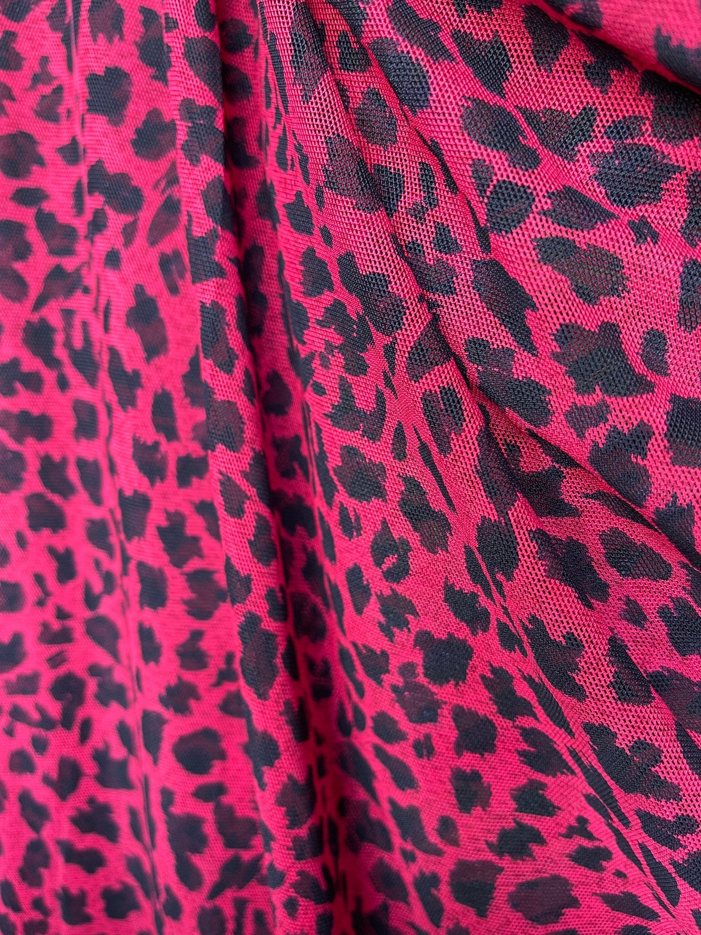 New power mesh animal printCheetah design red/black 4-way stretch 58/60” Sold by the YD. Ships worldwide from Los Angeles California USA.