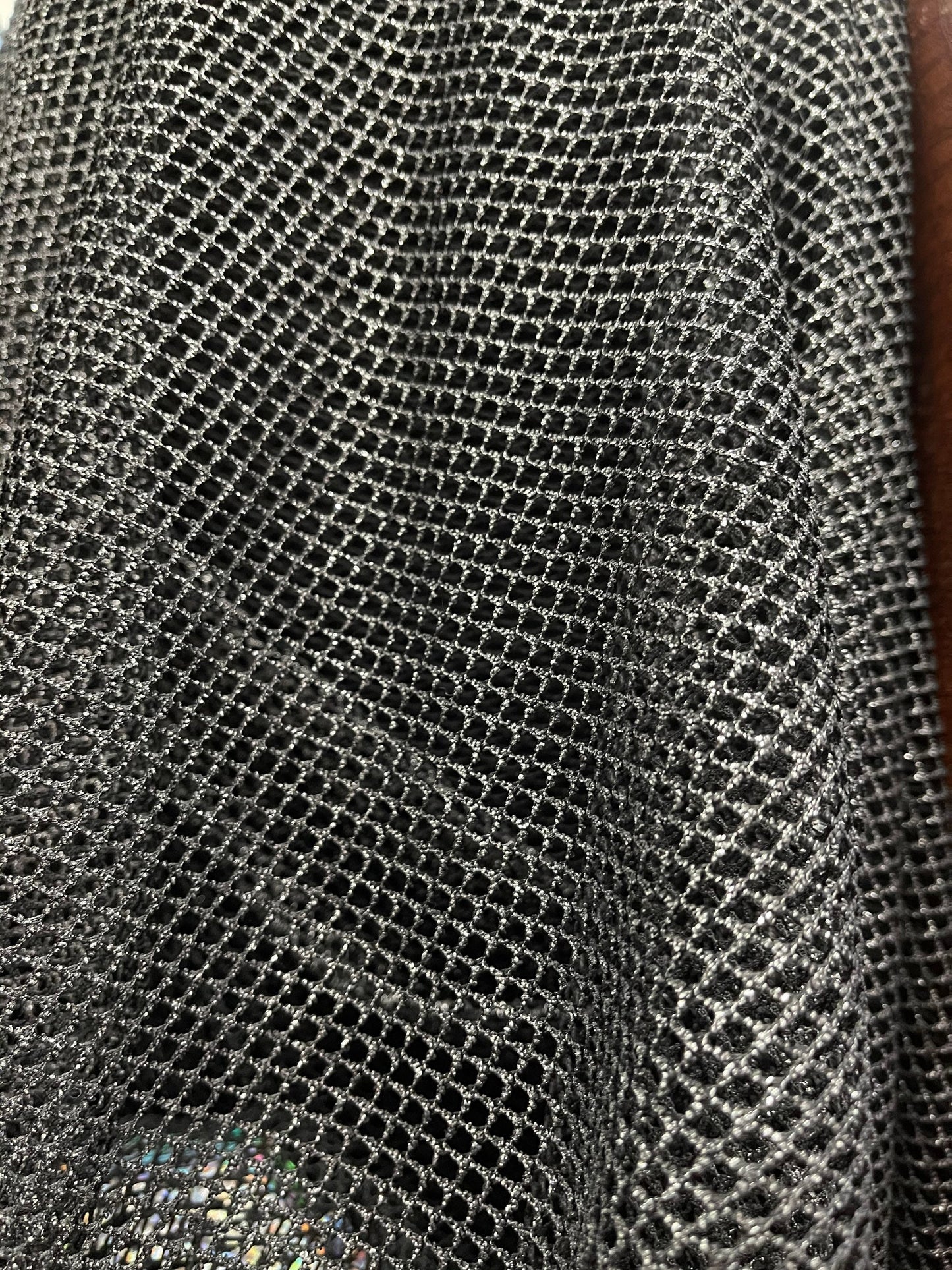 Metallic fishnet Black/Silver 2-way stretch 58/60” Sold by the YD. Ships Worldwide from Los Angeles California USA.