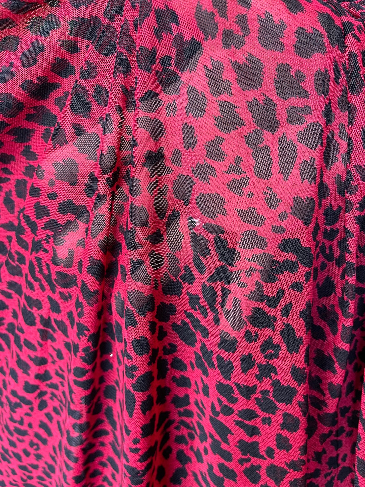 New power mesh animal printCheetah design red/black 4-way stretch 58/60” Sold by the YD. Ships worldwide from Los Angeles California USA.