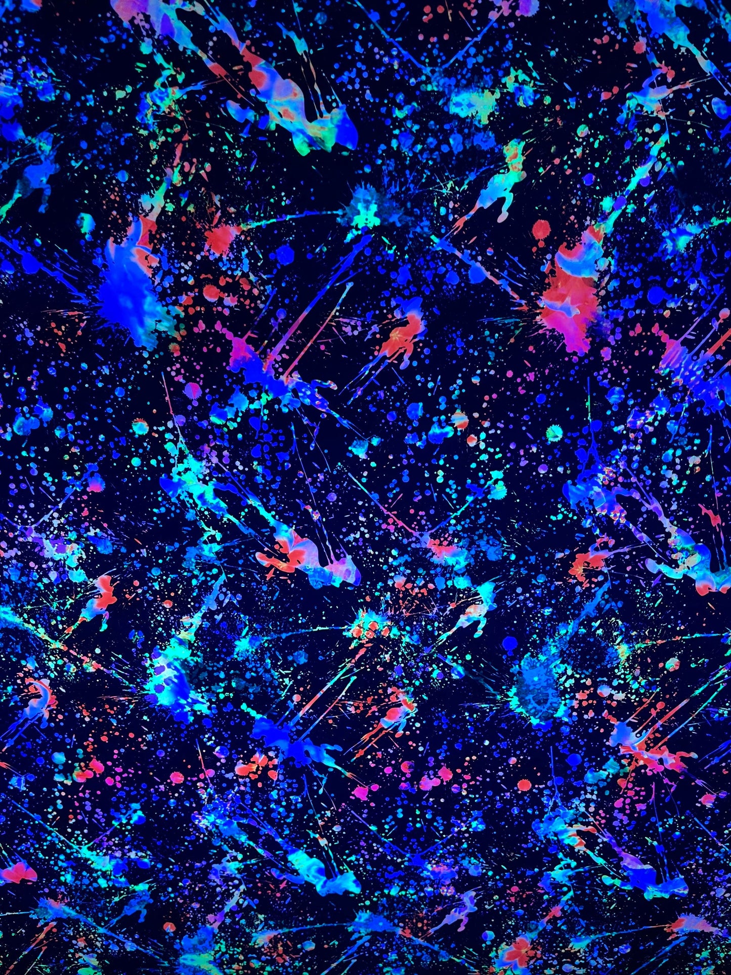 New splatter paint design Black/Multicolor print on nylon and mesh spandex 4-way stretch 58/60” Sold by the YD