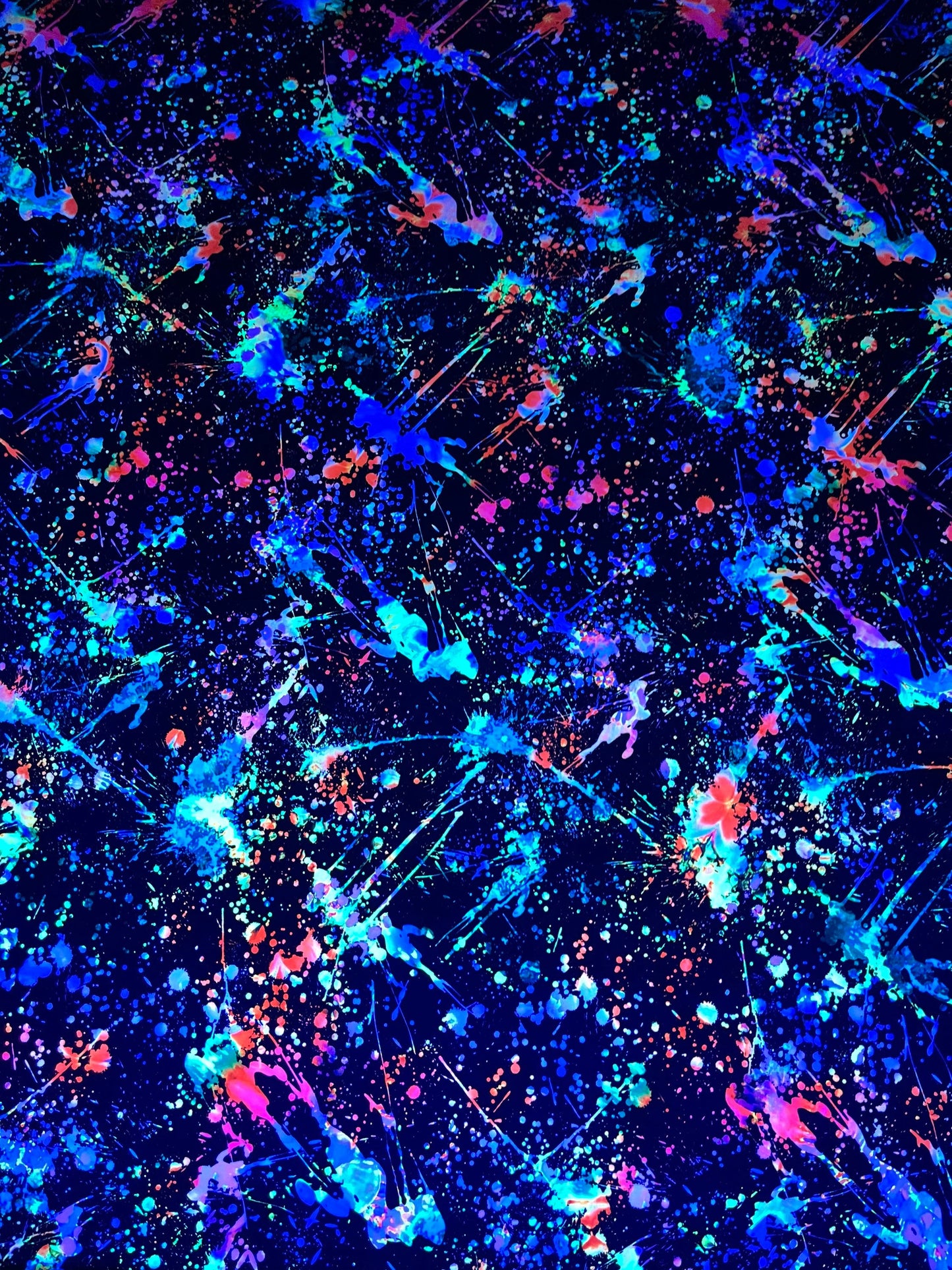 New splatter paint design Black/Multicolor print on nylon and mesh spandex 4-way stretch 58/60” Sold by the YD