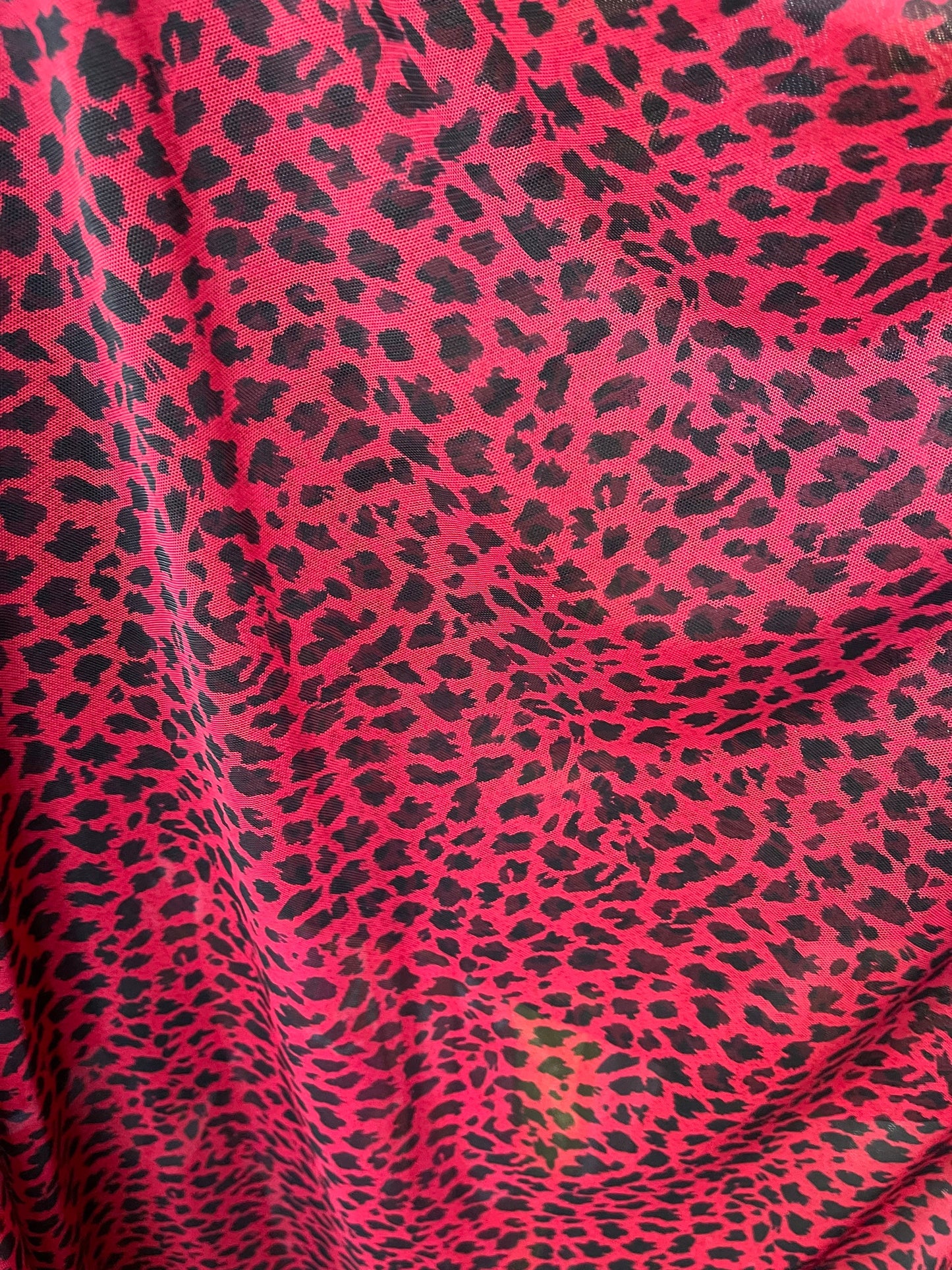 New power mesh animal print leopard design red/black 4-way stretch 58/60” Sold by the YD. Ships worldwide from Los Angeles California USA.