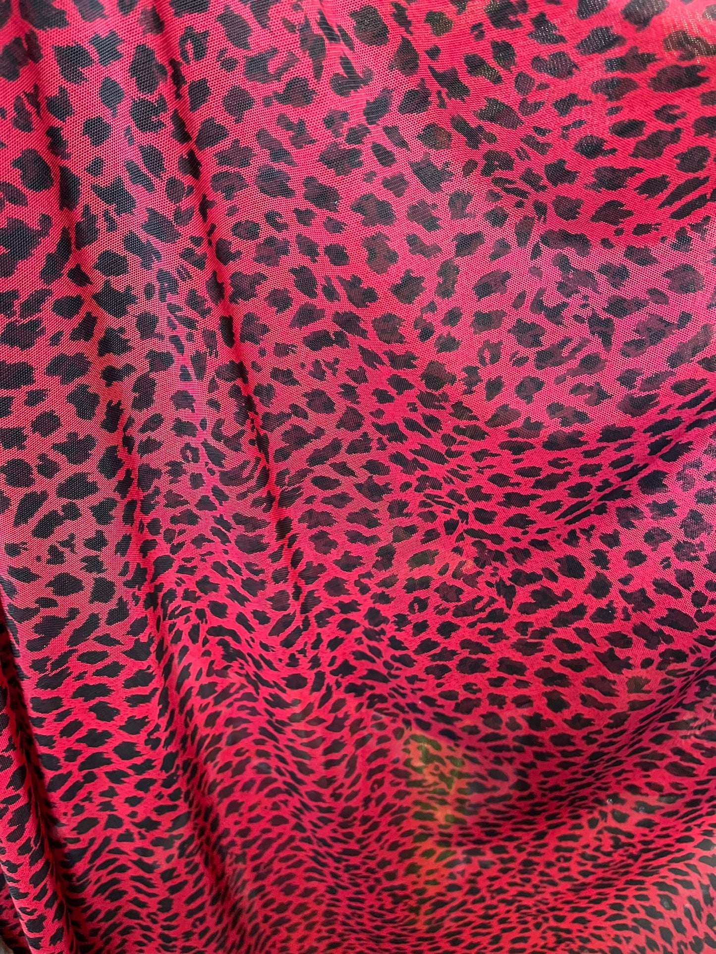 New power mesh animal print leopard design red/black 4-way stretch 58/60” Sold by the YD. Ships worldwide from Los Angeles California USA.