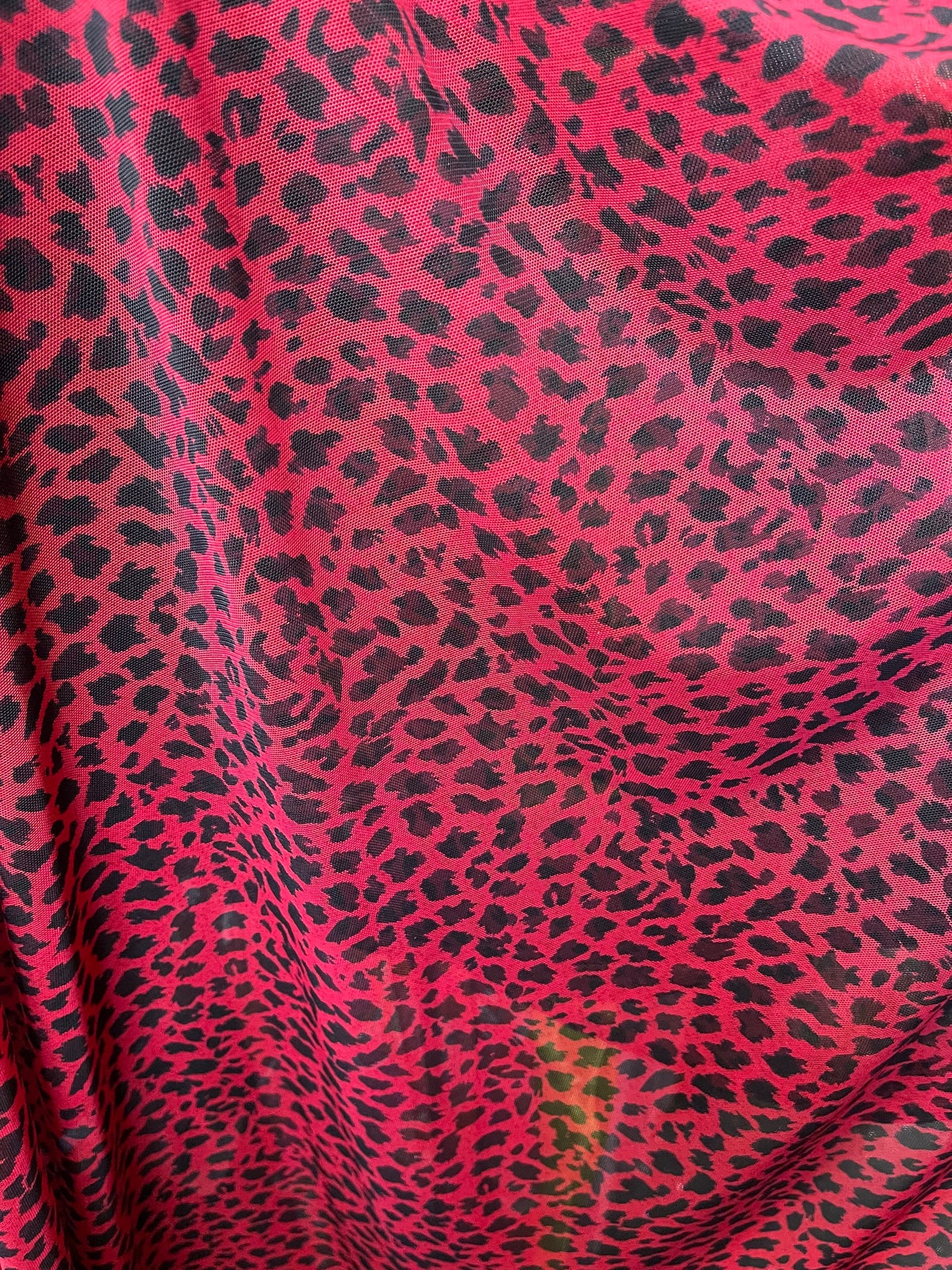 New power mesh animal print leopard design red/black 4-way stretch 58/60” Sold by the YD. Ships worldwide from Los Angeles California USA.