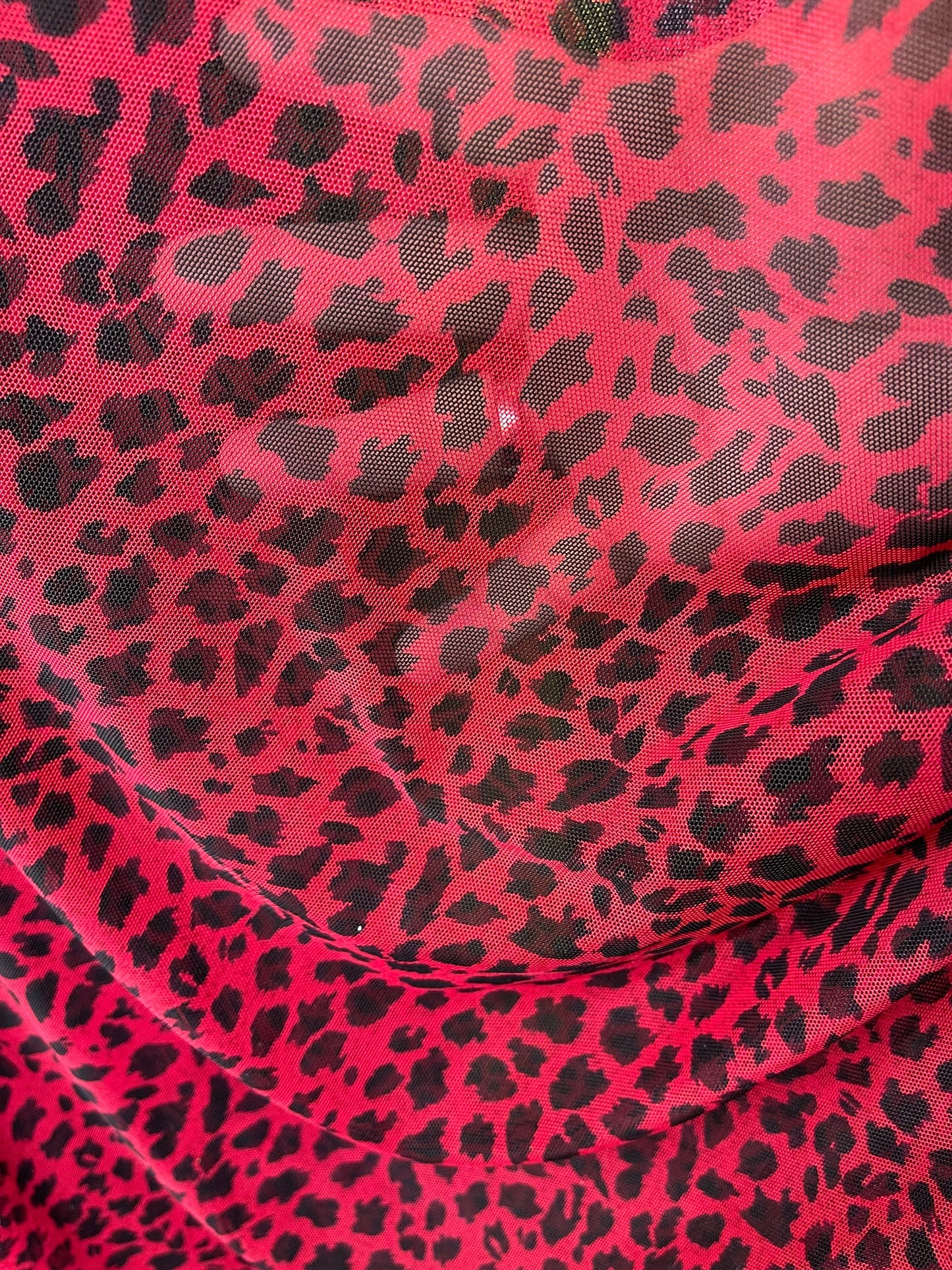 New power mesh animal print leopard design red/black 4-way stretch 58/60” Sold by the YD. Ships worldwide from Los Angeles California USA.