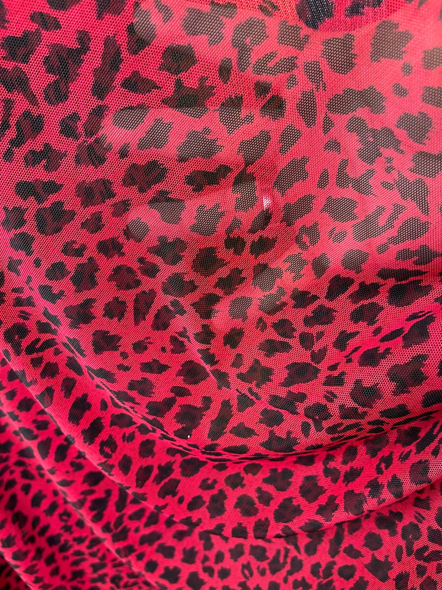 New power mesh animal print leopard design red/black 4-way stretch 58/60” Sold by the YD. Ships worldwide from Los Angeles California USA.