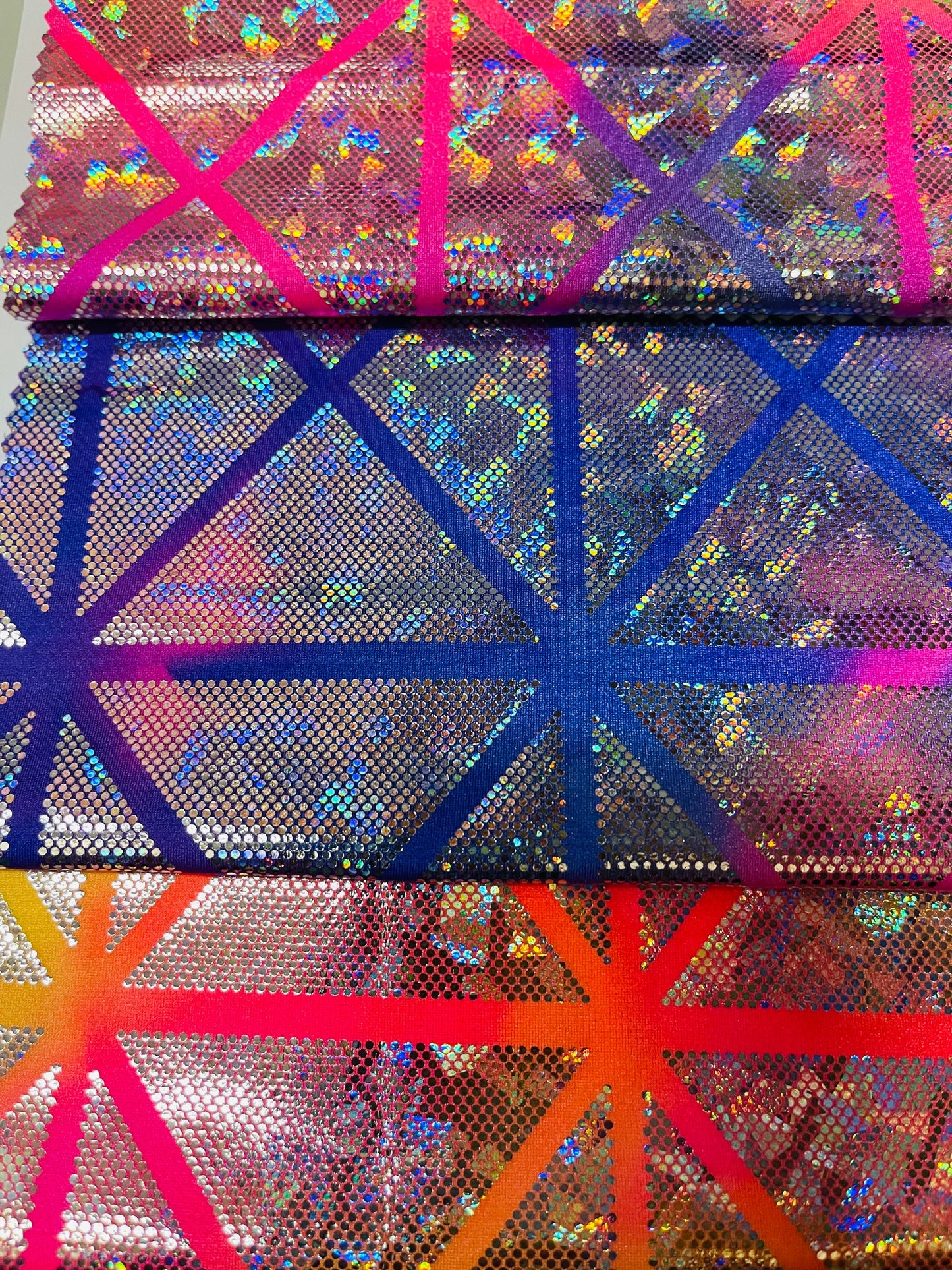 New Laser Geometric design hologram metallic nylon spandex 4-way stretch 58/60” Sold by the YD. Ships Worldwide from Los Angeles CA USA