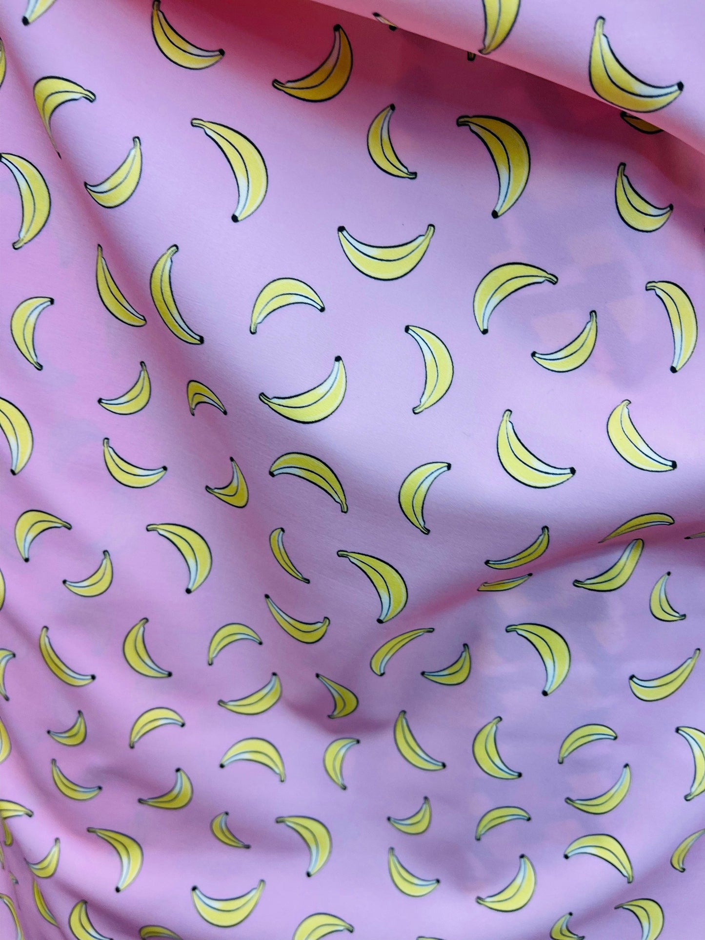 New Banana design blush/yellow print on great quality of Nylon Spandex 4-way stretch 58/60” Sold by the YD. Ships Worldwide from Los Angeles