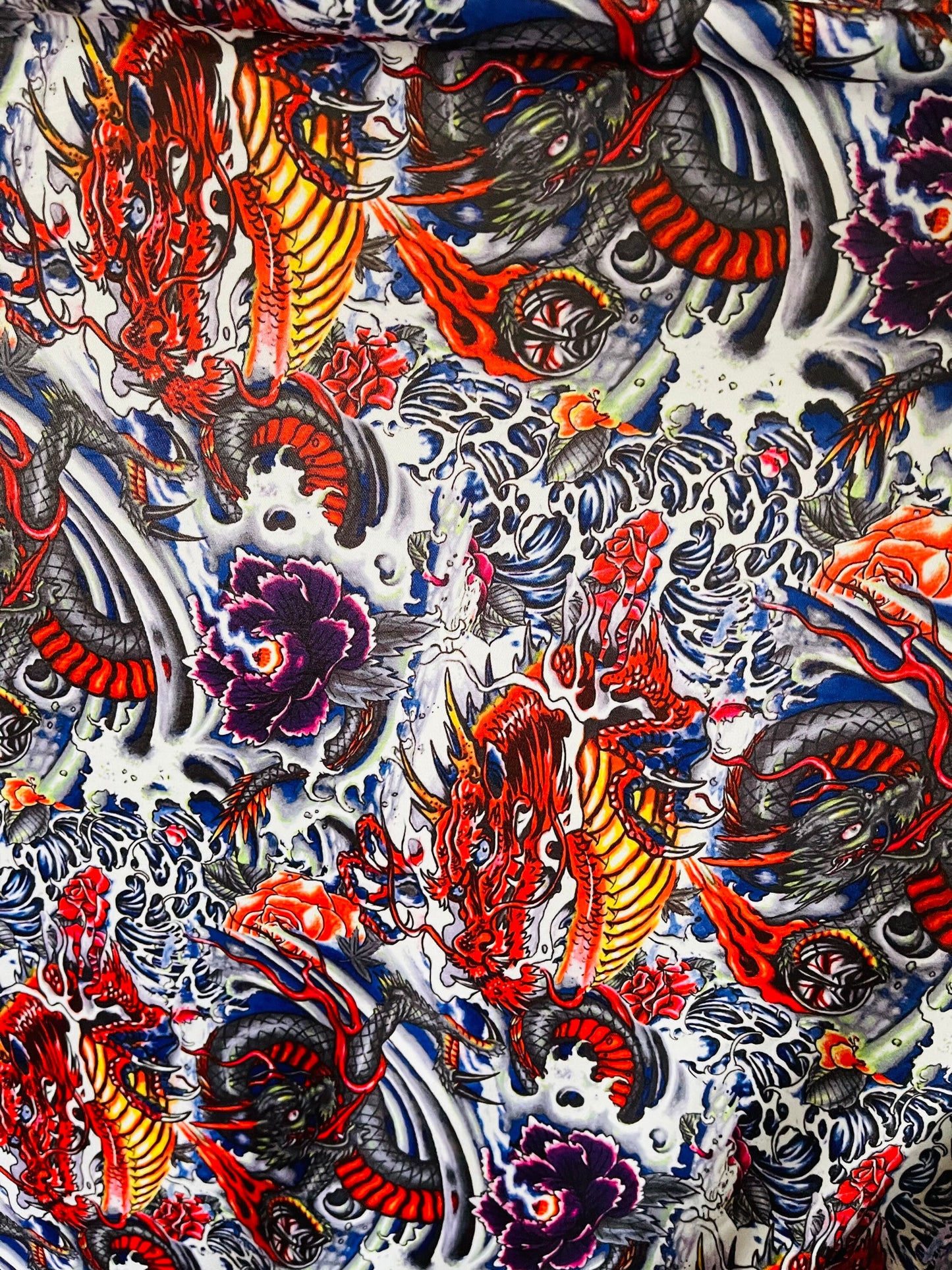 New Exotic Tattoo Dragon design Multicolor print on best quality of Nylon Spandex 4-way stretch 58/60” Sold by the YD. Ships Worldwide