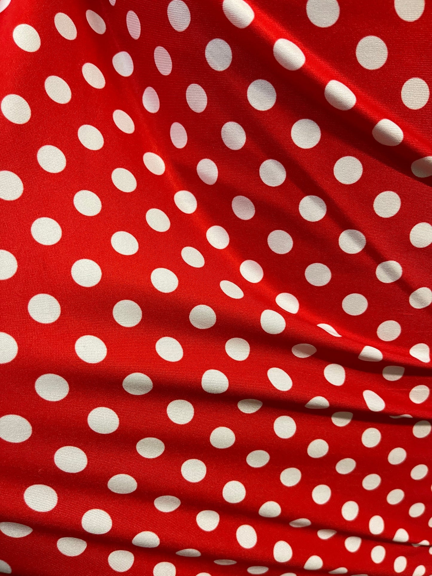 New spandex polka dots Design Red/white 4 way stretch poly spandex 58/60” Sold by the YD. Ships worldwide from Los Angeles California USA.