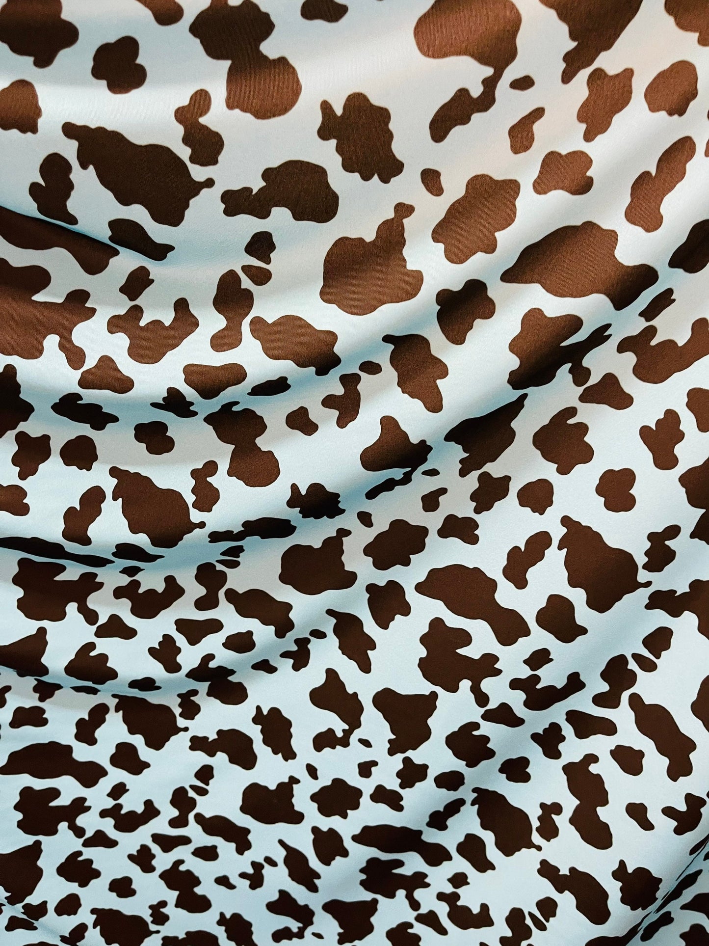 Exotic cow design Turquoise/Black print on great quality of Nylon Spandex 4-way stretch 58/60” Sold by the YD. Ships Worldwide