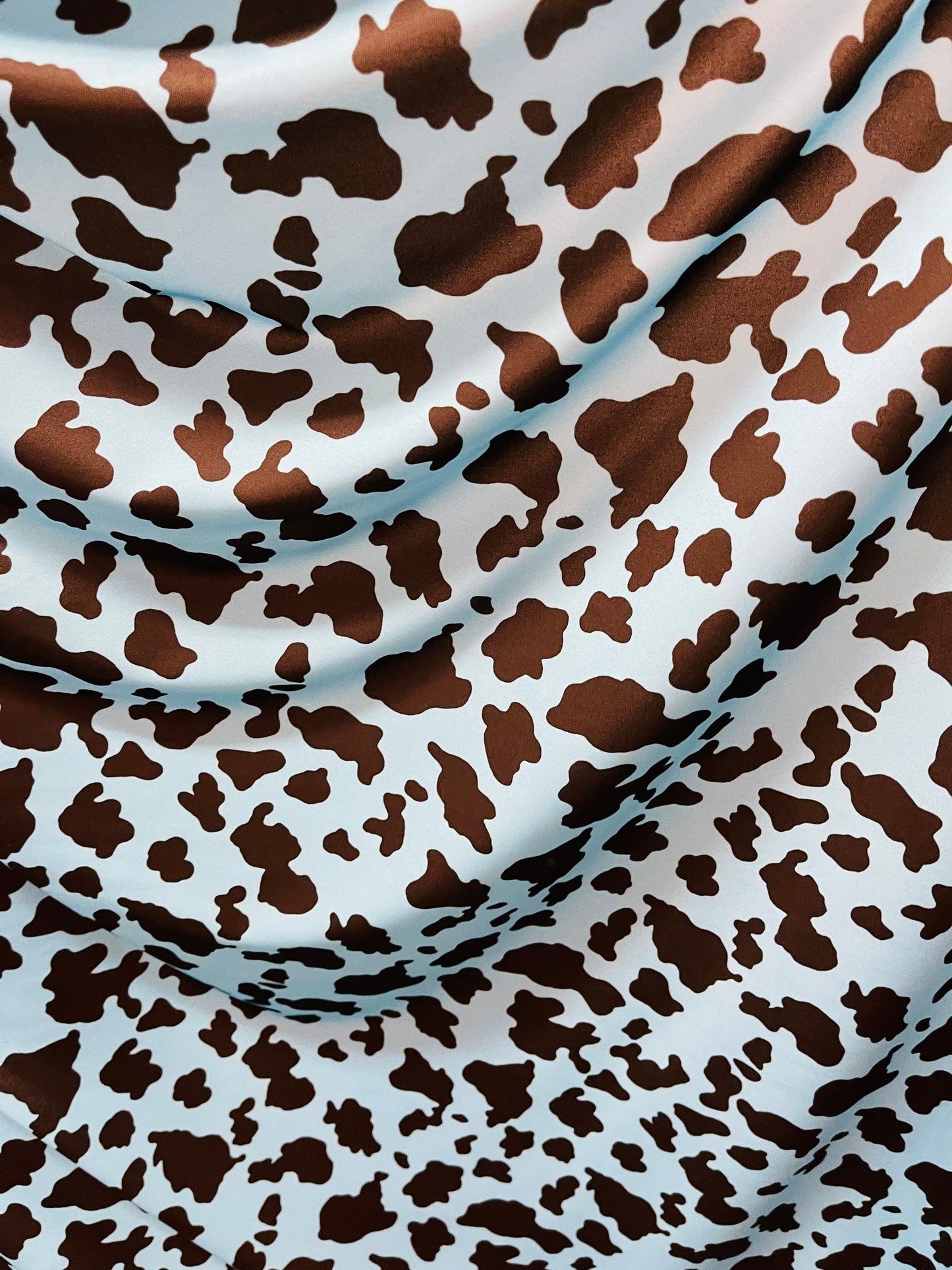 Exotic cow design Turquoise/Black print on great quality of Nylon Spandex 4-way stretch 58/60” Sold by the YD. Ships Worldwide