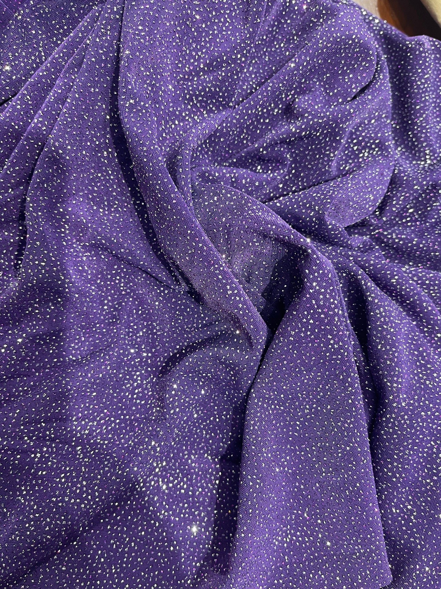 Selena design purple/silver poly spandex with glitter all over 4-way stretch 58/60” Sold by the YD. Ships Worldwide from Los Angeles CA