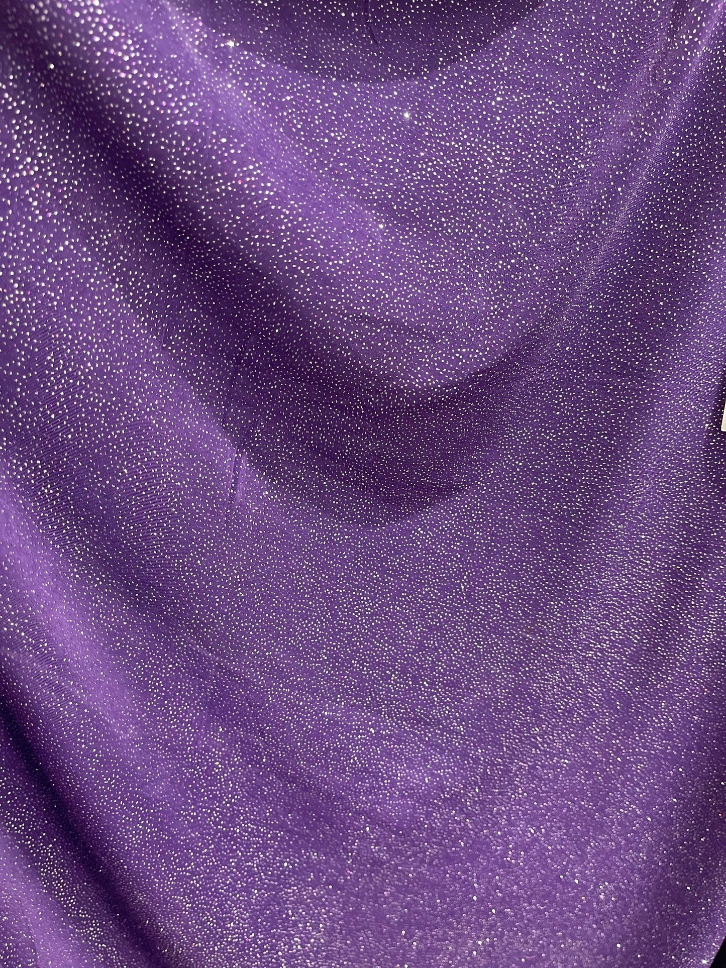 Selena design purple/silver poly spandex with glitter all over 4-way stretch 58/60” Sold by the YD. Ships Worldwide from Los Angeles CA