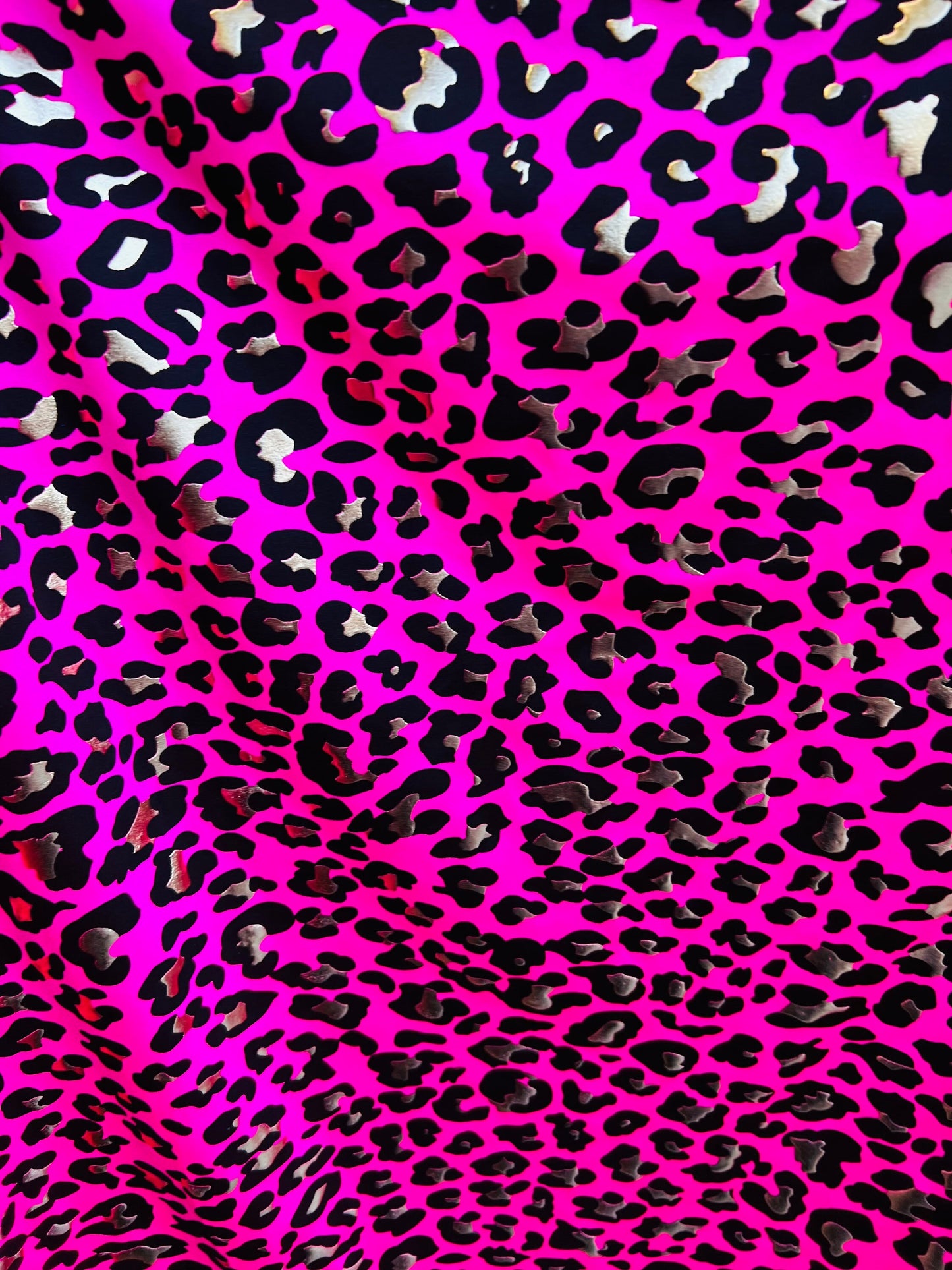 Metallic Exotic leopard design Pink/Gold it glows in the dark with black light best quality of nylon spandex 4-way stretch 58/60”