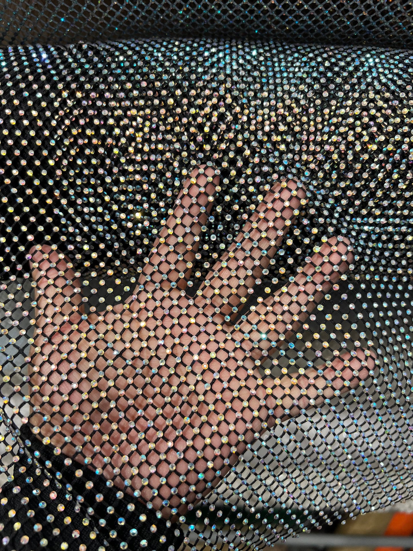 New Luxury Rhinestone stretch mesh fabric all over 4-way stretch 58/60” Sold by the YD. Ships Worldwide from Los Angeles California USA.