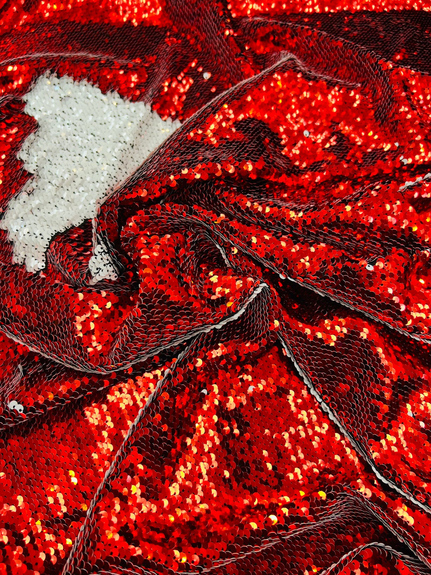 Mermaid sequins red/white reversible sequins embroidered on spandex base 2-way stretch 55/57” Sold by the YD. Ships Worldwide from Los Angel