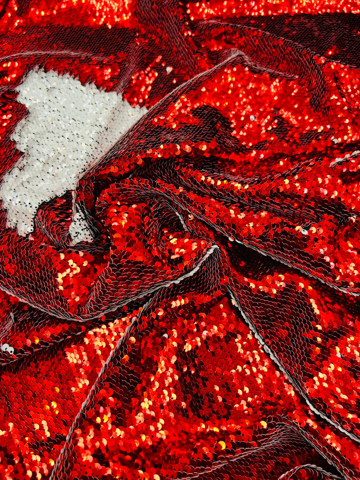 Mermaid sequins red/white reversible sequins embroidered on spandex base 2-way stretch 55/57” Sold by the YD. Ships Worldwide from Los Angel