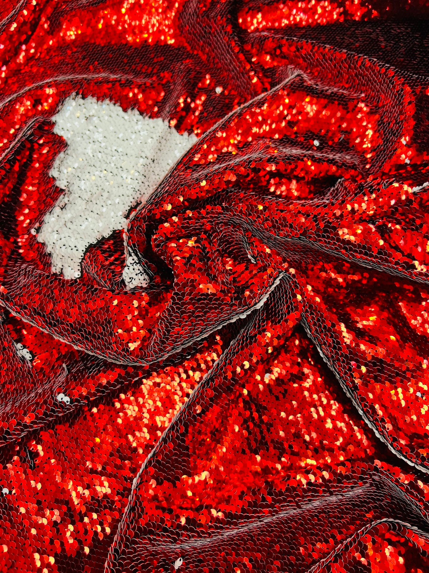 Mermaid sequins red/white reversible sequins embroidered on spandex base 2-way stretch 55/57” Sold by the YD. Ships Worldwide from Los Angel